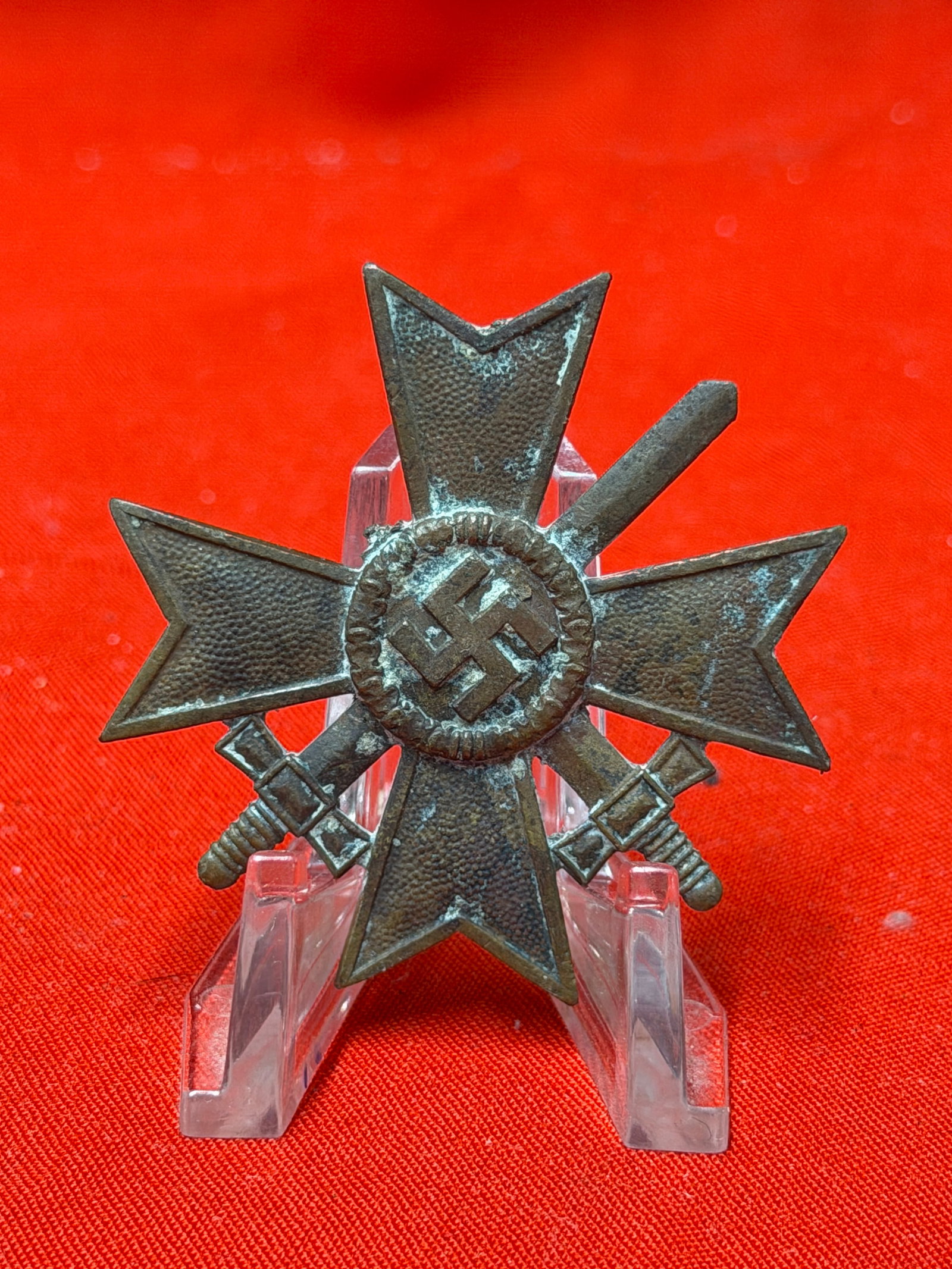 WWII German War Merit Cross 1939 with Swords Pinback Badge: World War II era German War Merit Cross themed pinback badge featuring crossed swords and central swastika motif on the front with “1939” reverse design. In our opinion, the piece is construct