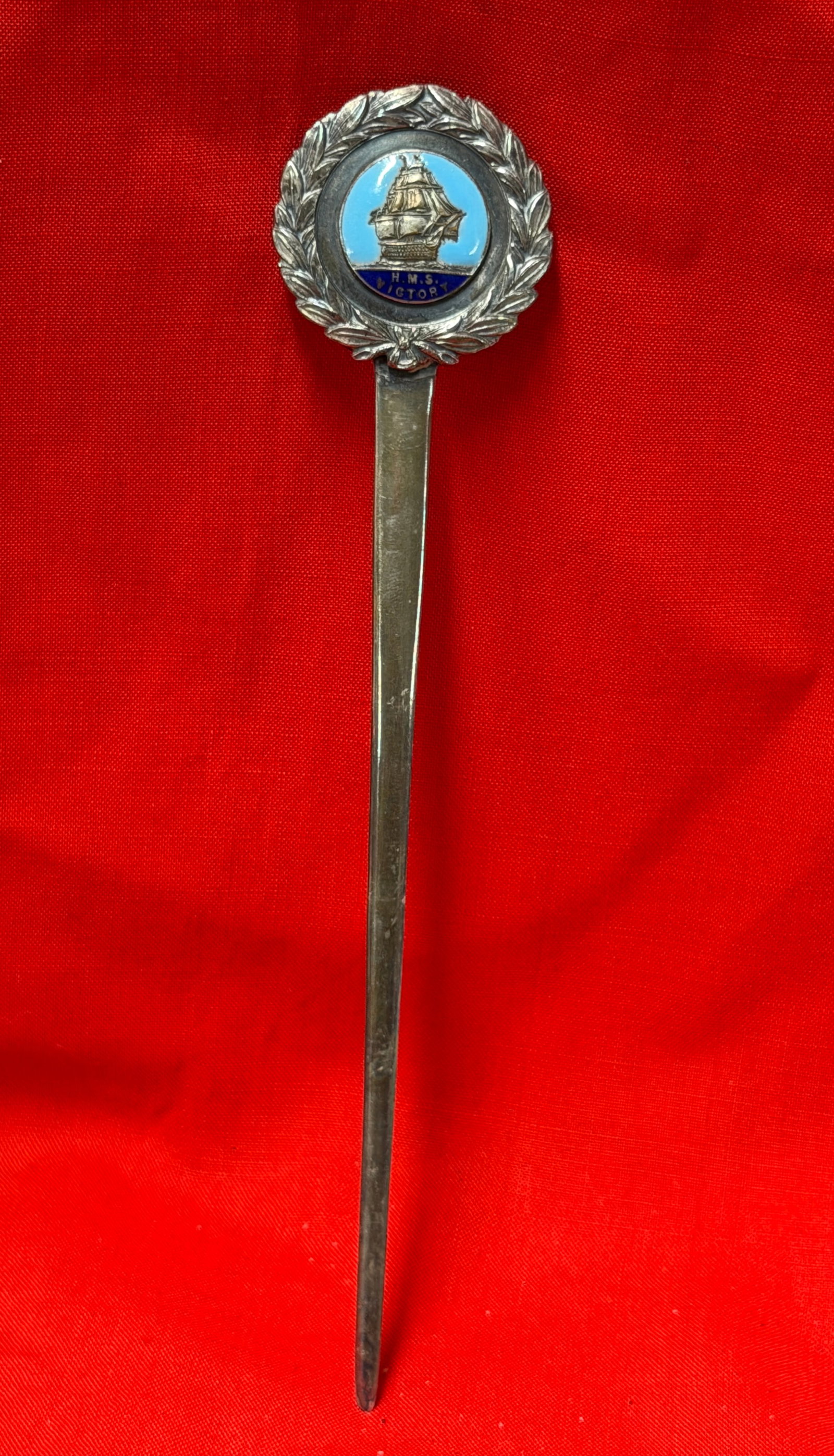 Vintage HMS Victory Sterling Silver Enamel Letter Opener: Vintage sterling silver letter opener featuring a detailed enamel crest of the famous British warship H.M.S. Victory set within a laurel wreath design. The colorful enamel medallion depicts the histor