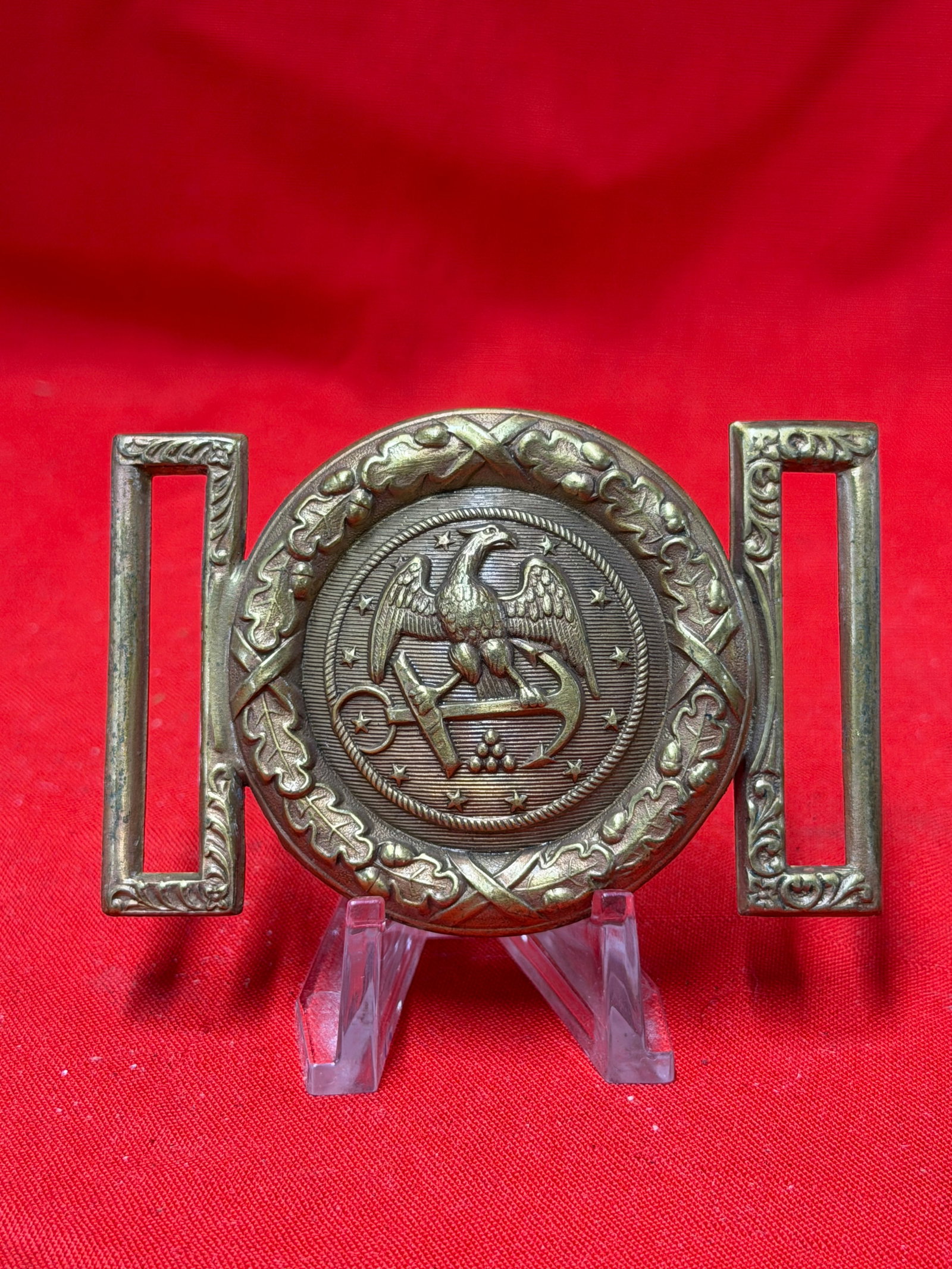 Civil War Style U.S. Navy Two Piece Brass Belt Buckle: Civil War style U.S. Navy two piece brass belt buckle featuring an American eagle over crossed anchor and cannon motif surrounded by stars and oak leaf decoration. The buckle retains its classic oval 