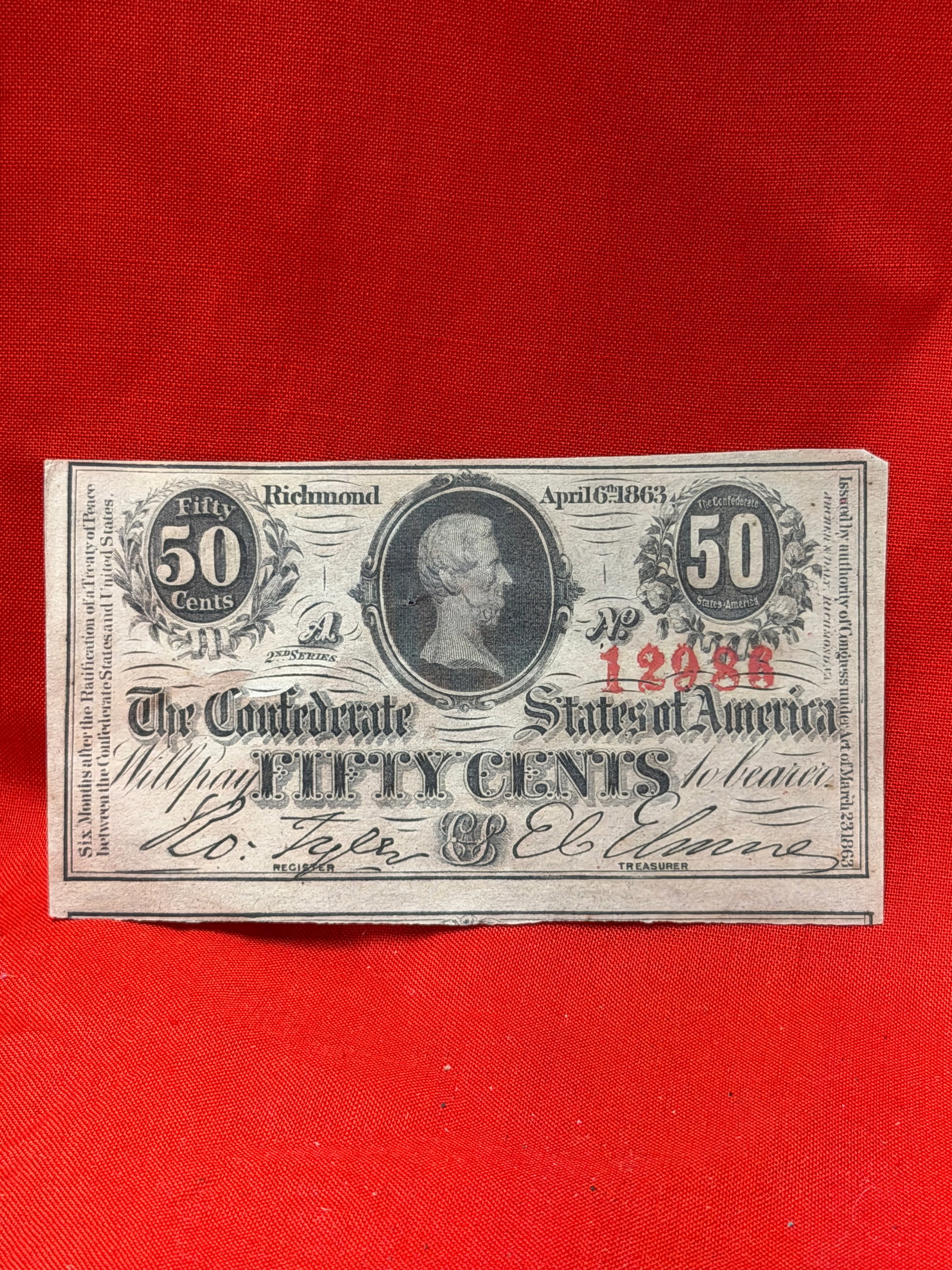 Civil War 1863 Confederate States of America 50 Cents Note – Richmond, Virginia – April 6, 1863: Confederate States of America 50 Cents fractional currency note issued in Richmond, Virginia and dated April 6, 1863. This Civil War era note features a portrait of Jefferson Davis at center with orna