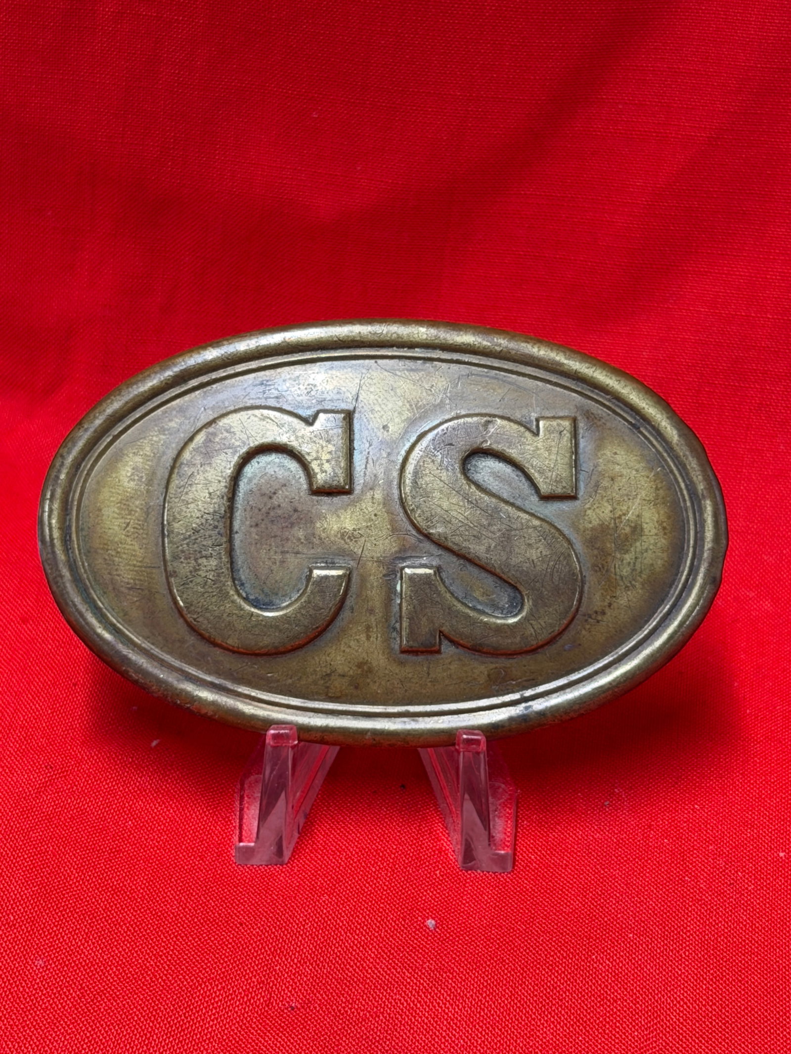 Civil War Era CS Confederate States Brass Belt Plate Buckle Oval Militaria Display Piece: Oval brass belt plate with raised CS lettering and iron hook attachments on reverse. In our opinion this buckle represents a Confederate States cavalry or military related belt plate from the Civil Wa
