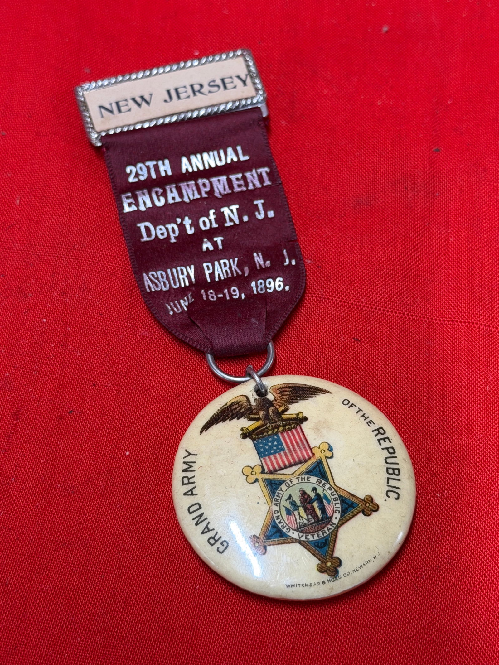 1896 Grand Army of the Republic New Jersey Encampment Badge – Asbury Park NJ Veteran Reunion: 1896 Grand Army of the Republic (G.A.R.) reunion badge from the 29th Annual Encampment, Department of New Jersey, held in Asbury Park, New Jersey on June 18–19, 1896. Features a decorative “NEW JE