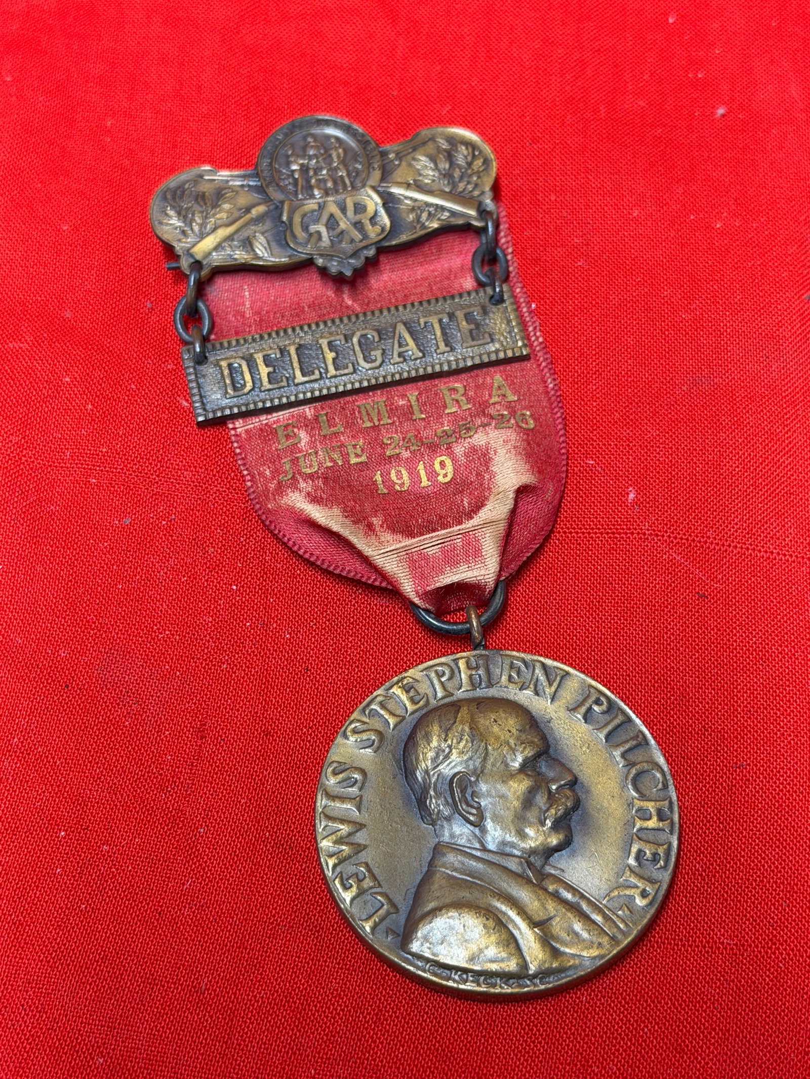 1919 G.A.R. Delegate Badge – 53rd Annual Encampment Elmira NY – Dept. of New York Civil War: 1919 Grand Army of the Republic (G.A.R.) delegate badge from the 53rd Annual Encampment of the Department of New York, held in Elmira, New York, June 24–26, 1919. Features an ornate bronze-tone G.A.