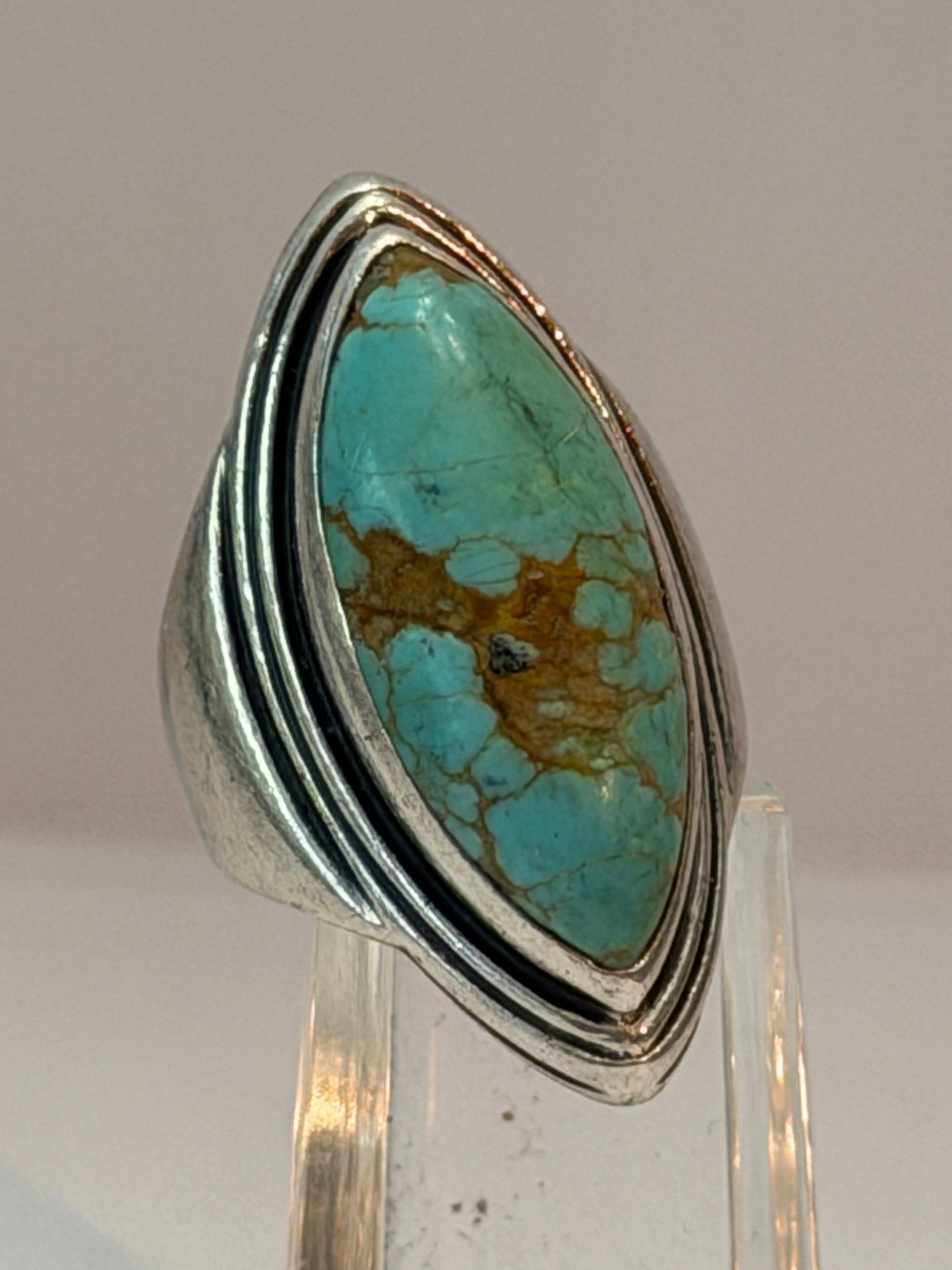Vintage Sterling Silver Turquoise Ring Size 5 Navajo Style Marquise Statement Ring: Vintage sterling silver Southwestern style ring featuring a large marquise-shaped turquoise stone with natural brown matrix. The sleek shadowbox-inspired setting and clean tapered band give this piece