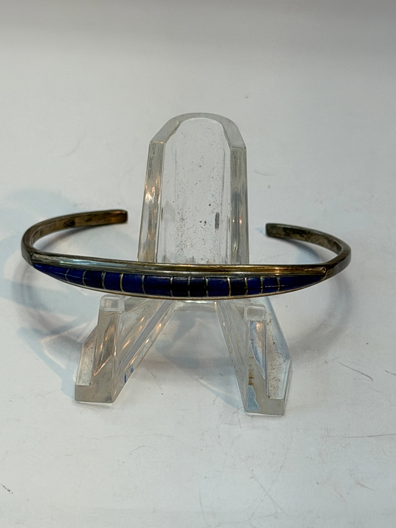 Vintage Sterling Silver Lapis Inlay Cuff Bracelet Signed CEH Southwestern Minimalist: Vintage sterling silver cuff bracelet featuring a sleek channel inlay of deep cobalt blue lapis lazuli stones in a clean minimalist Southwestern design. Elegant tapered open cuff with finely segmented