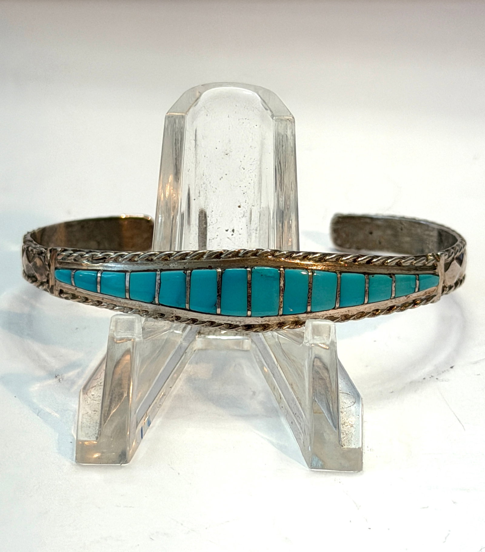 Sterling Silver Turquoise Inlay Cuff Bracelet Signed MP Southwestern Rope Border: Vintage sterling silver cuff bracelet featuring vibrant turquoise channel inlay in a classic Southwestern design. Beautifully handcrafted with detailed twisted rope borders and hand-tooled diamond acc