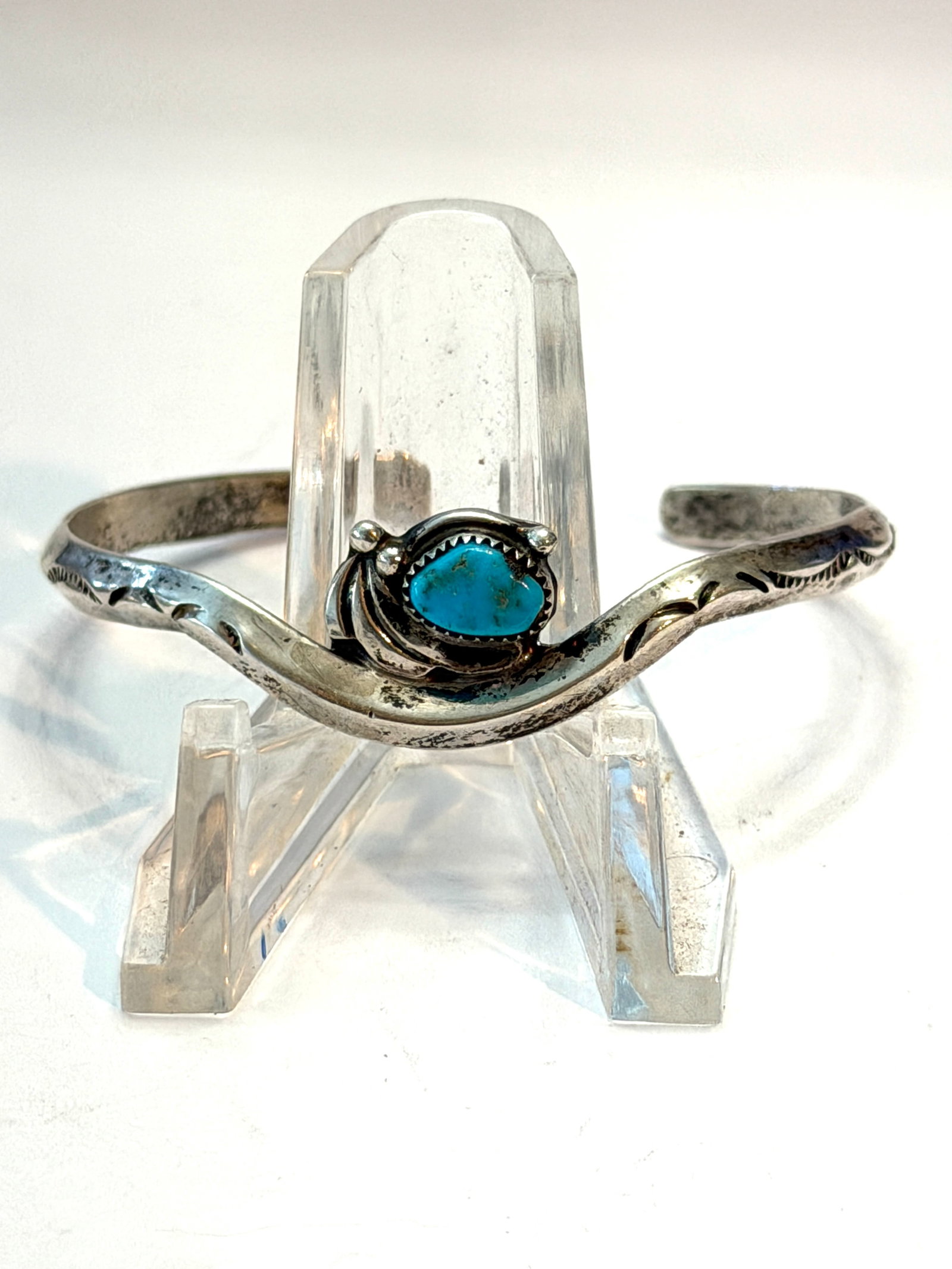 Vintage Rattlesnake Sterling Silver Turquoise Cuff Bracelet Signed Southwestern Native Style: Vintage sterling silver cuff bracelet featuring a natural turquoise stone in a raised bezel setting with distinctive Southwestern styling. The cuff has a hand-formed wavy design with stamped decorativ