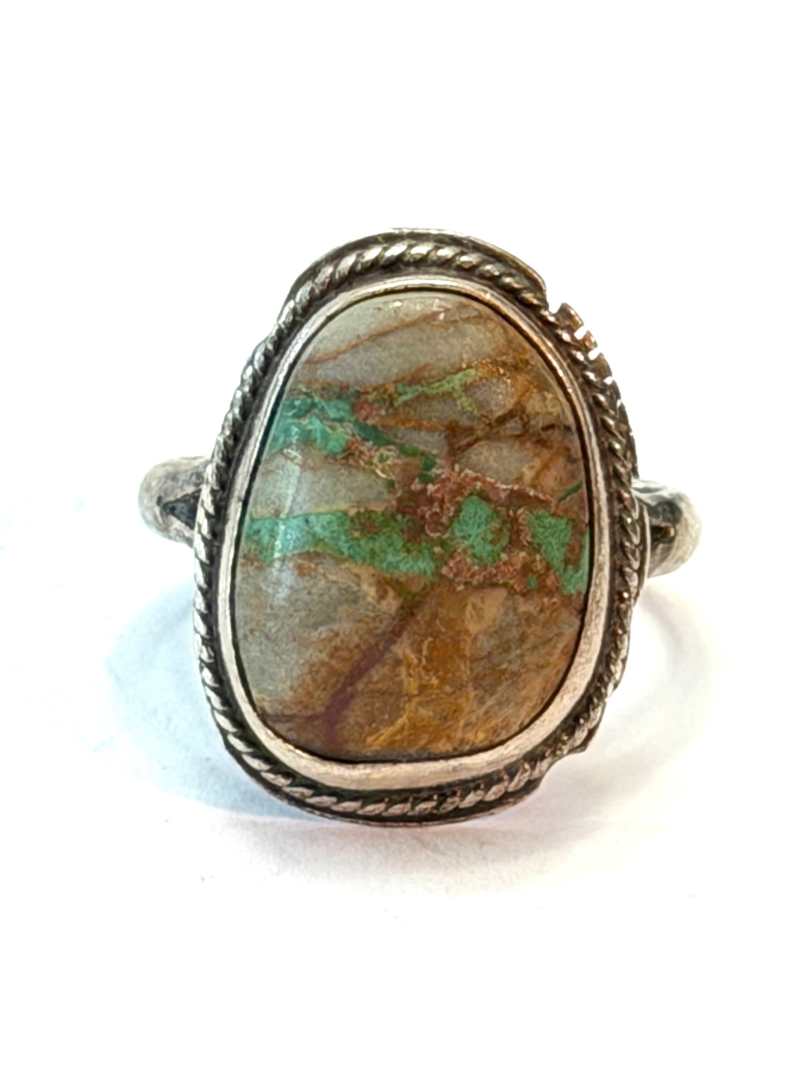 Vintage LL Sterling Silver Turquoise Matrix Ring Southwestern Native American Style Size 7.75: Vintage sterling silver ring featuring a large natural turquoise matrix cabochon with striking earthy brown and green veining. The stone is bezel set in a classic Southwestern style mounting with twis