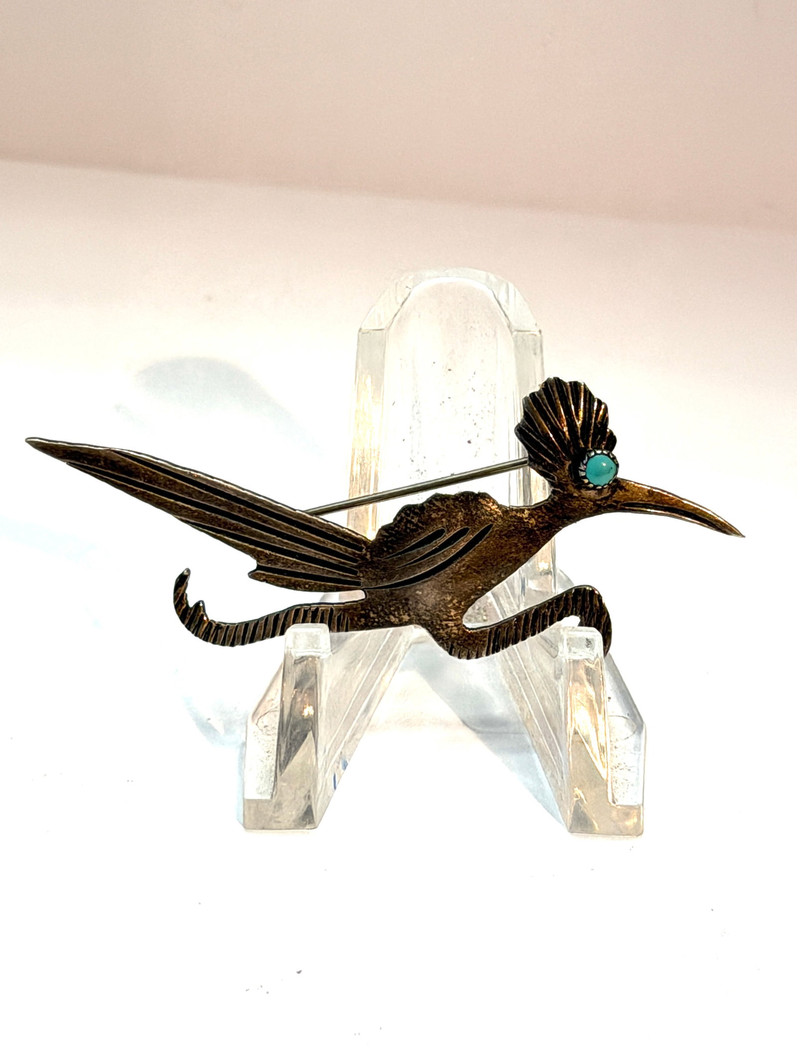 Sterling Silver Roadrunner Brooch Pin Turquoise Eye Southwest Style: Vintage sterling silver roadrunner brooch pin featuring a sleek Southwest style design with engraved feather details and a turquoise stone eye. Beautifully crafted with a long tail, curved legs, and d