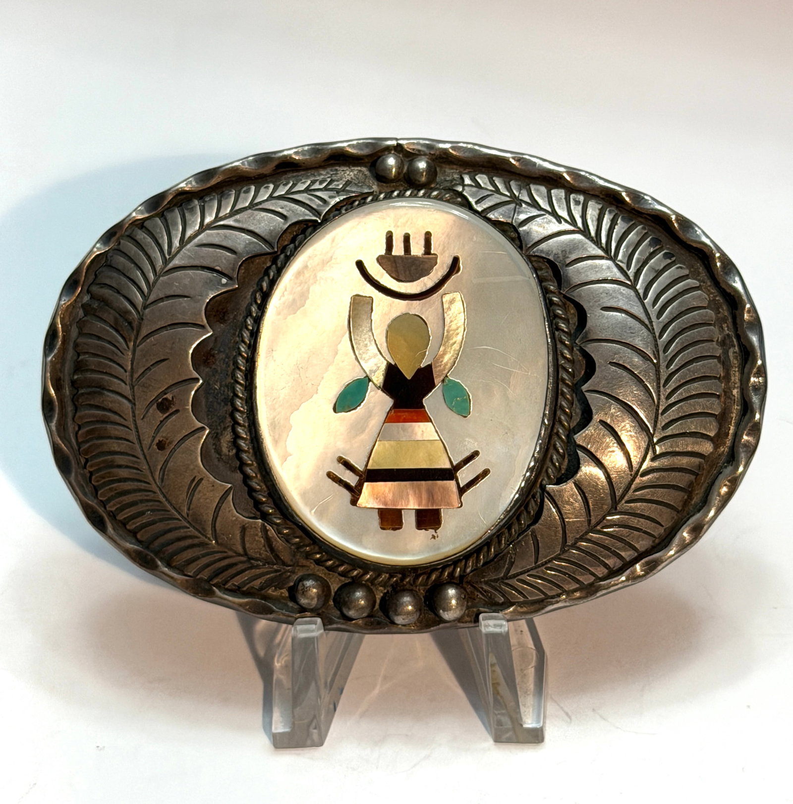 Vintage Southwestern Sterling Silver Mother of Pearl Kokopelli Inlay Belt Buckle Signed C.J.: Beautiful vintage Southwestern sterling silver belt buckle featuring a detailed inlaid Kokopelli dancer motif set against a luminous mother of pearl background. The buckle showcases classic hand-stamp