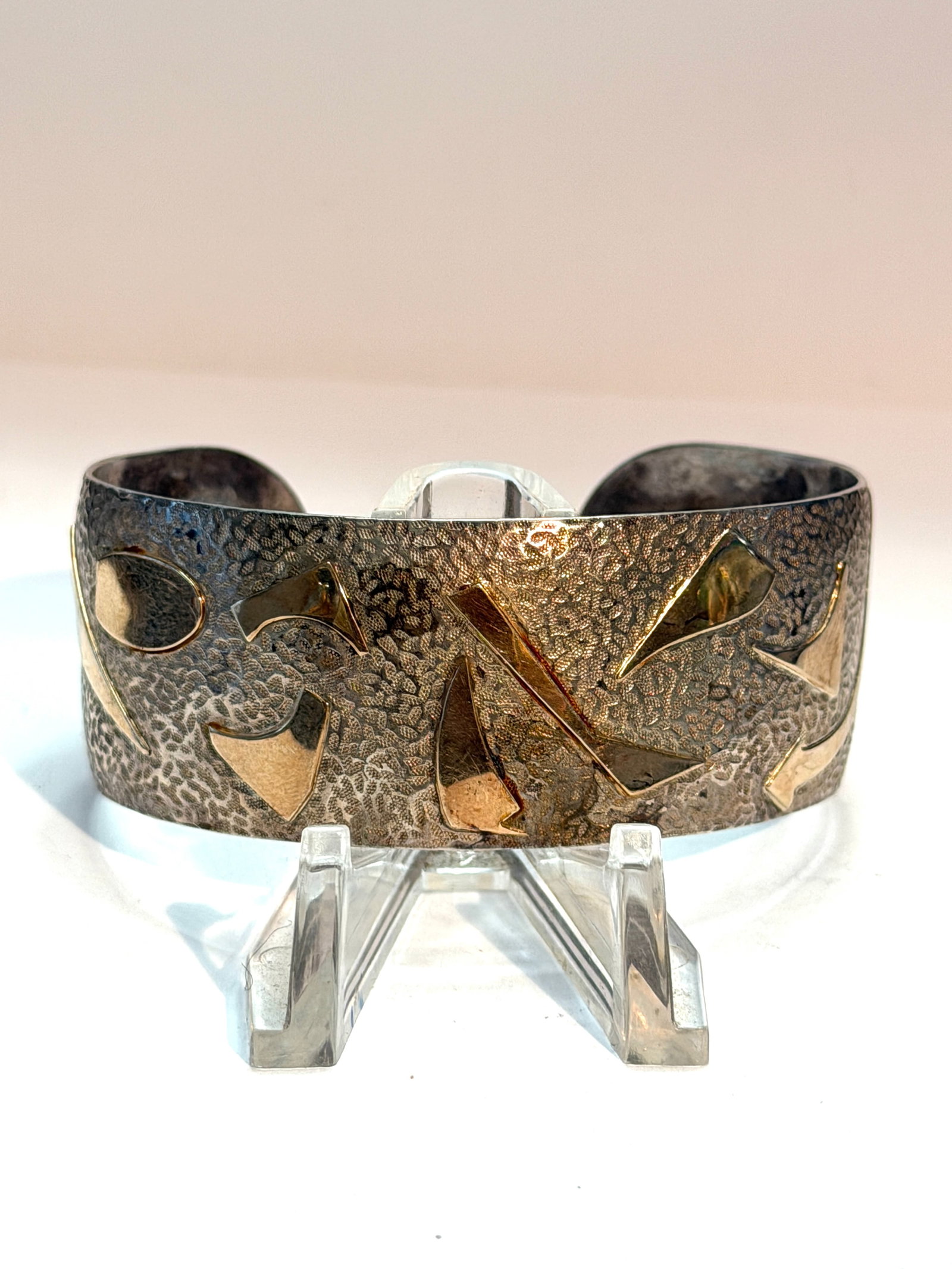 Vintage Terrell 14K Gold & Sterling Silver Overlay Cuff Bracelet ? Modernist Textured Artisan Design: Vintage artisan cuff bracelet by Terrell crafted in sterling silver with applied 14K gold overlay geometric accents. Features a richly textured hammered finish with abstract modernist gold shapes wrap