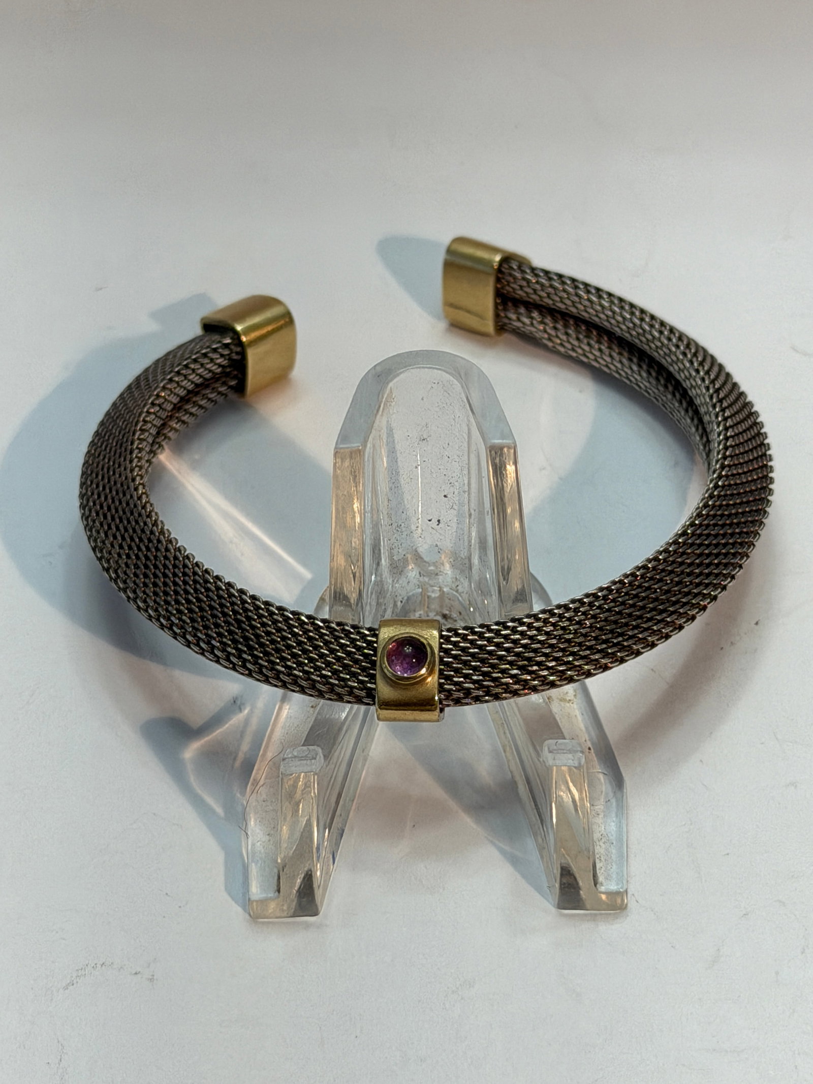 Designer Mesh Sterling Silver & 18K Gold Cuff Bracelet with Amethyst Accent: Vintage mesh cuff bracelet crafted in sterling silver with solid 18K gold accents and a bezel-set amethyst stone centerpiece. This elegant open cuff design features a flexible woven mesh body with sat
