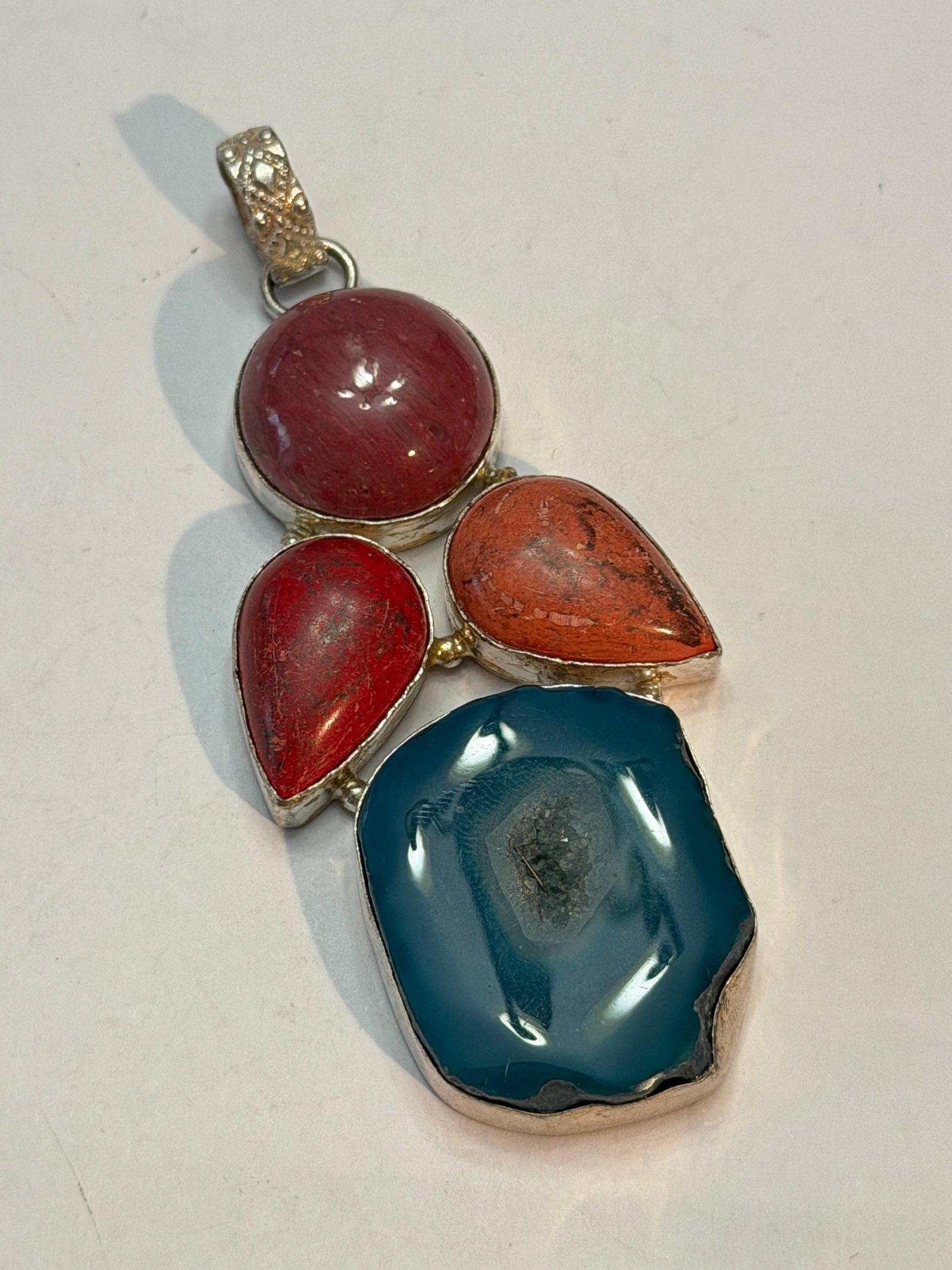 Sterling Silver Multi-Stone Pendant with Blue Druzy Agate, Coral & Rhodonite: Bold vintage sterling silver statement pendant featuring an artistic arrangement of natural cabochon stones including a large blue druzy agate slice, red coral-style teardrop cabochon, orange jasper o