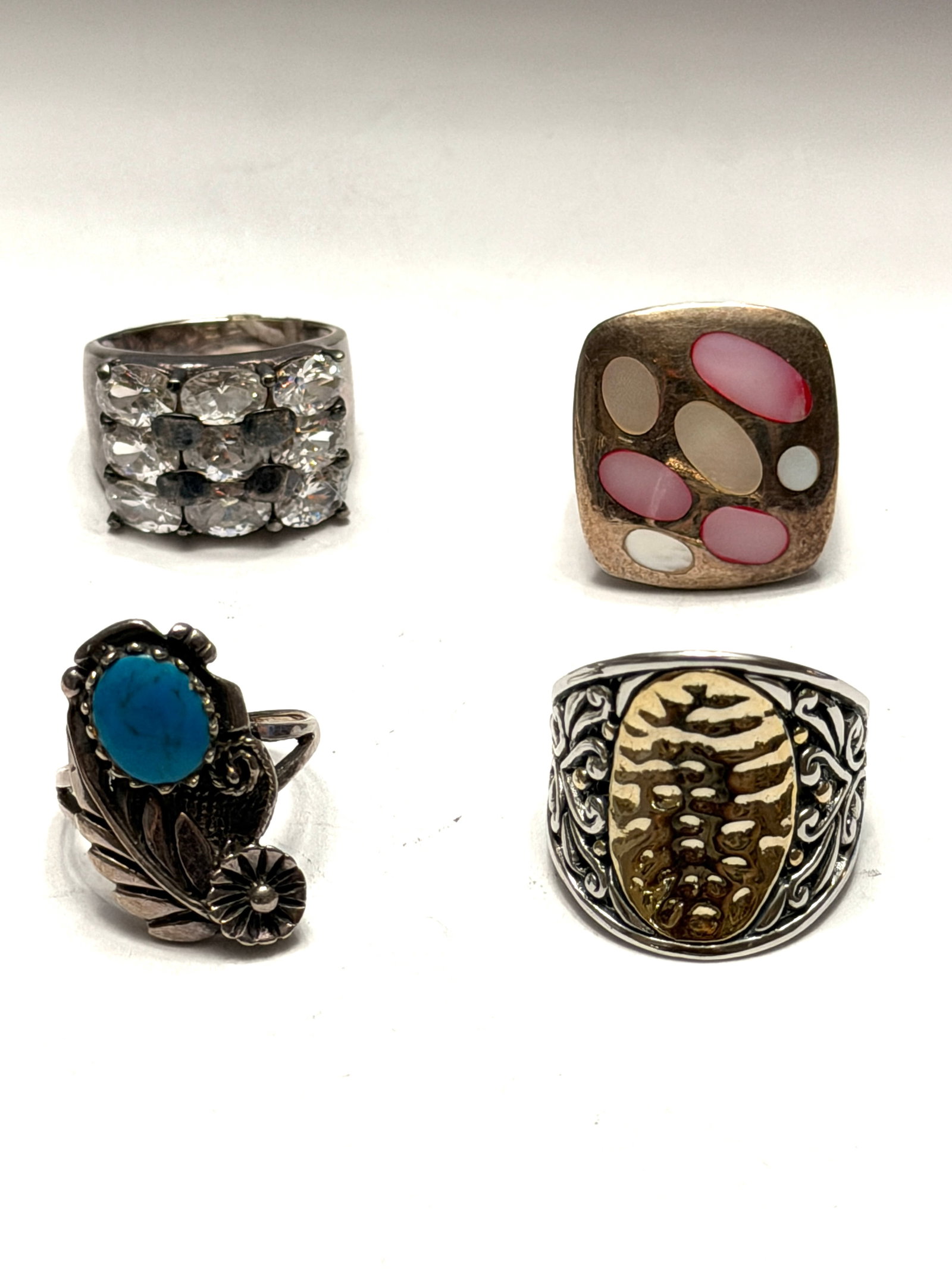 Vintage Sterling Silver Ring Lot Size 6?9 Art Deco Southwestern Rhinestone Statement Rings Mixed: Vintage mixed ring lot featuring four unique statement rings in sterling silver and silver-tone finishes. Includes a sparkling rhinestone cocktail band, a pink and white modernist inlay ring, a Southw