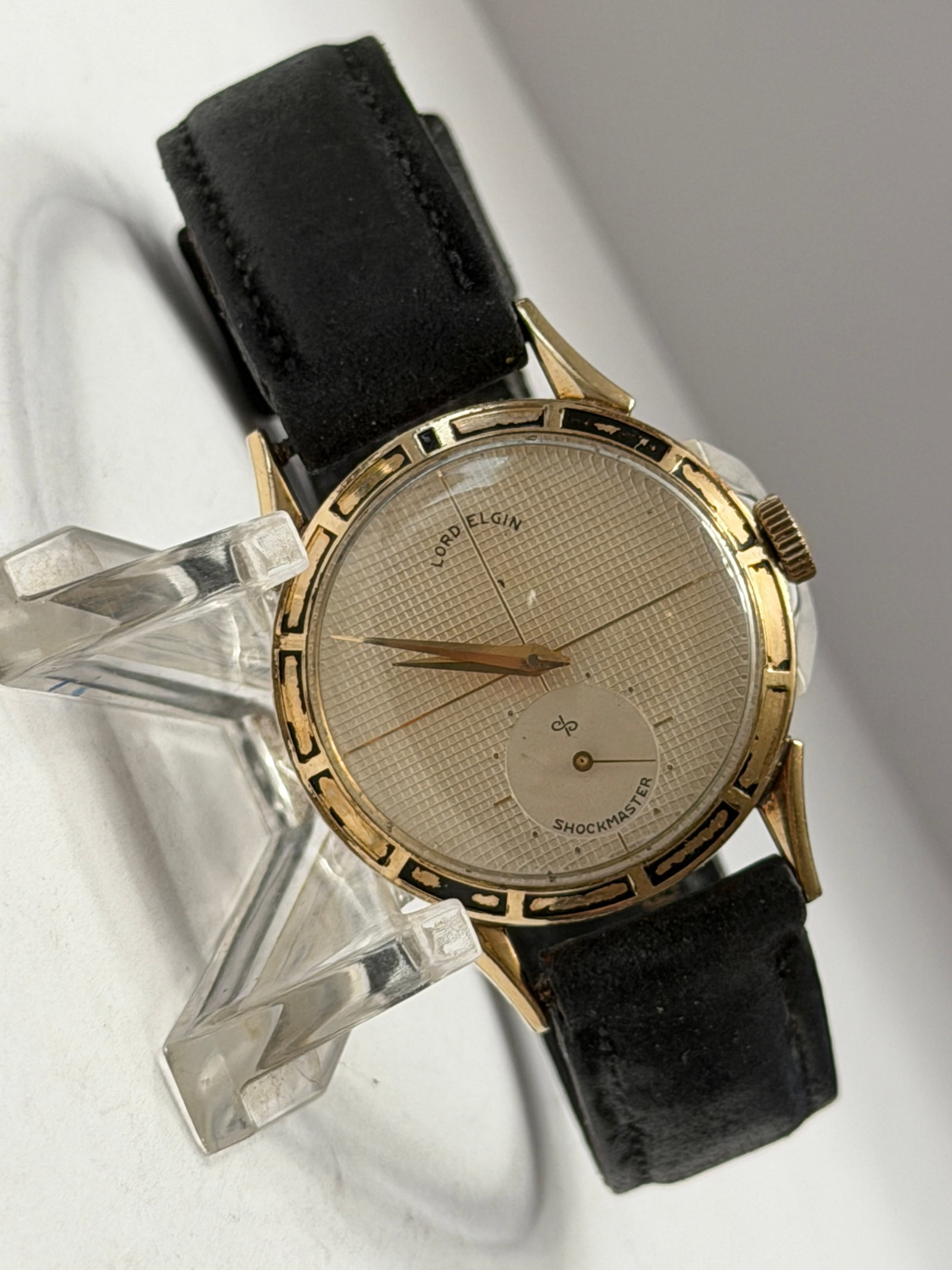 Vintage Lord Elgin Shockmaster Dress Wristwatch Gold Tone Textured Dial: Vintage Lord Elgin Shockmaster Dress Wristwatch featuring an elegant minimalist design with textured silver-tone dial, recessed small seconds subdial, and decorative black and gold chapter ring accent