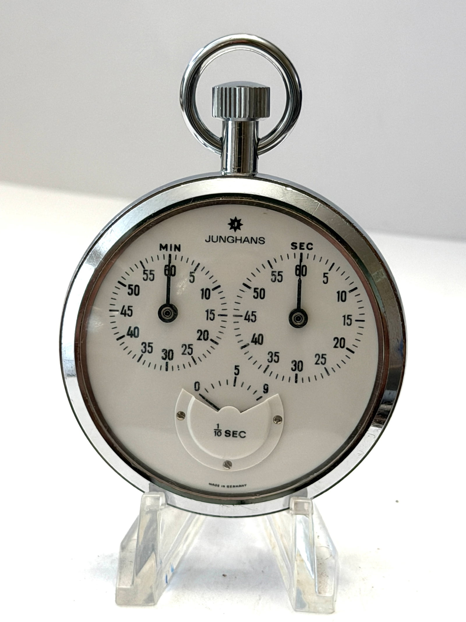 Vintage Junghans Mechanical Stopwatch Timer ? Made in Germany ? 1/10 Second Chronograph: Vintage Junghans mechanical stopwatch featuring a classic white dial with dual minute and second registers and a 1/10 second lower subdial. Made in Germany, this precision timer has a polished chrome-