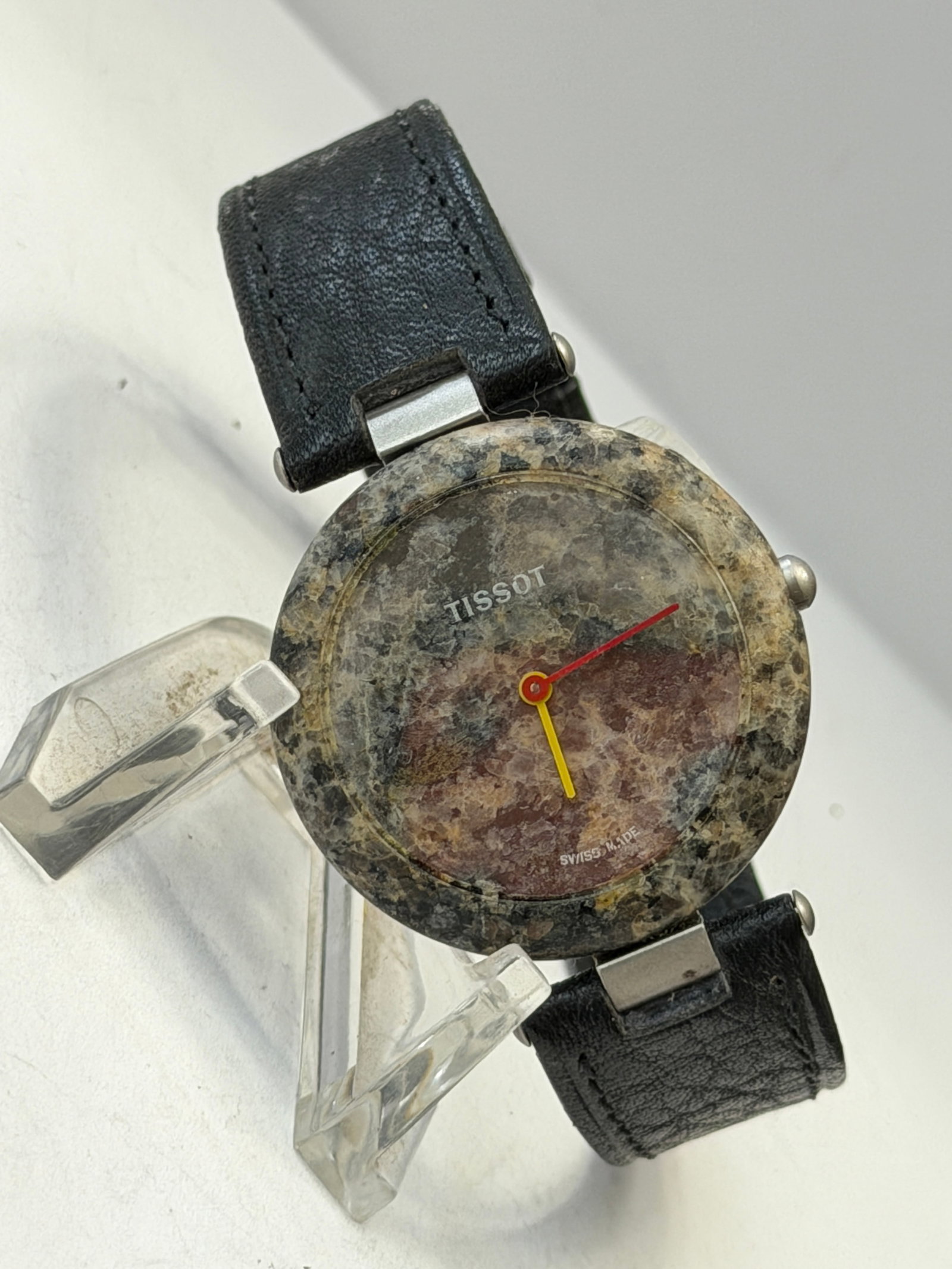 Vintage Tissot RockWatch Swiss Quartz Granite Stone Wristwatch ? Model R151: Vintage Tissot RockWatch Swiss quartz wristwatch featuring Tissot’s iconic natural granite stone case and matching stone dial design. The watch has a minimalist black-and-gray marbled stone appe