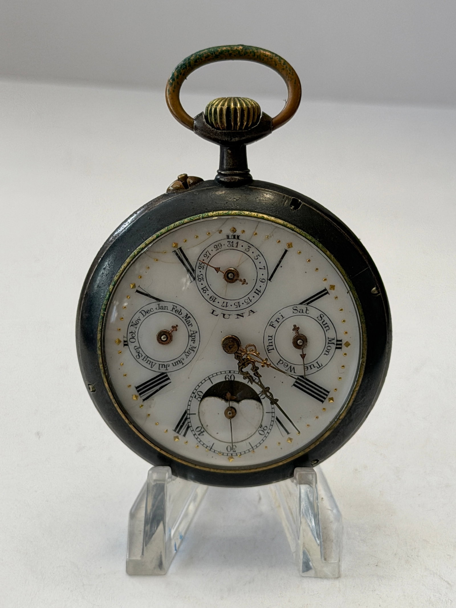 Antique Triple Calendar Moonphase Pocket Watch ? Open Face Mechanical Timepiece: Exceptional antique open-face mechanical pocket watch featuring an elaborate multi-calendar and moonphase dial configuration housed in a dark gunmetal-toned case. This highly decorative timepiece show