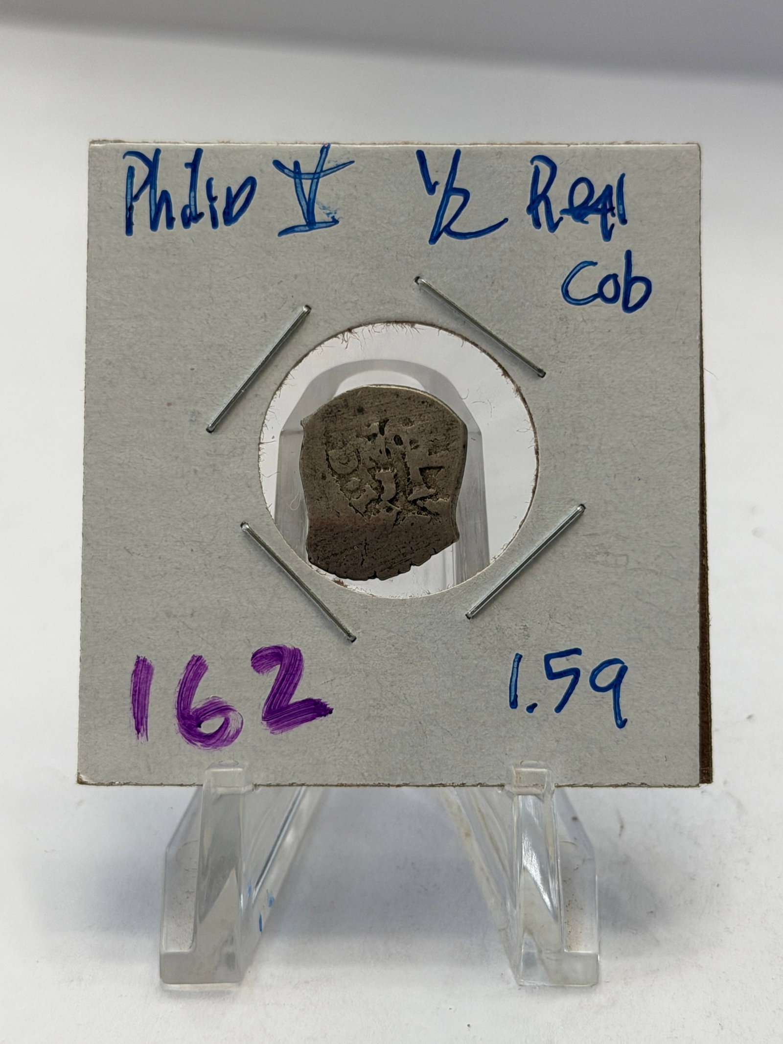 Philip V Spanish Colonial Silver Half Real Cob: Authentic Spanish Colonial silver cob struck during the reign of King Philip V of Spain (1700–1746), the first Bourbon king of Spain. This small hand-hammered cob is a ½ Real denomination, 