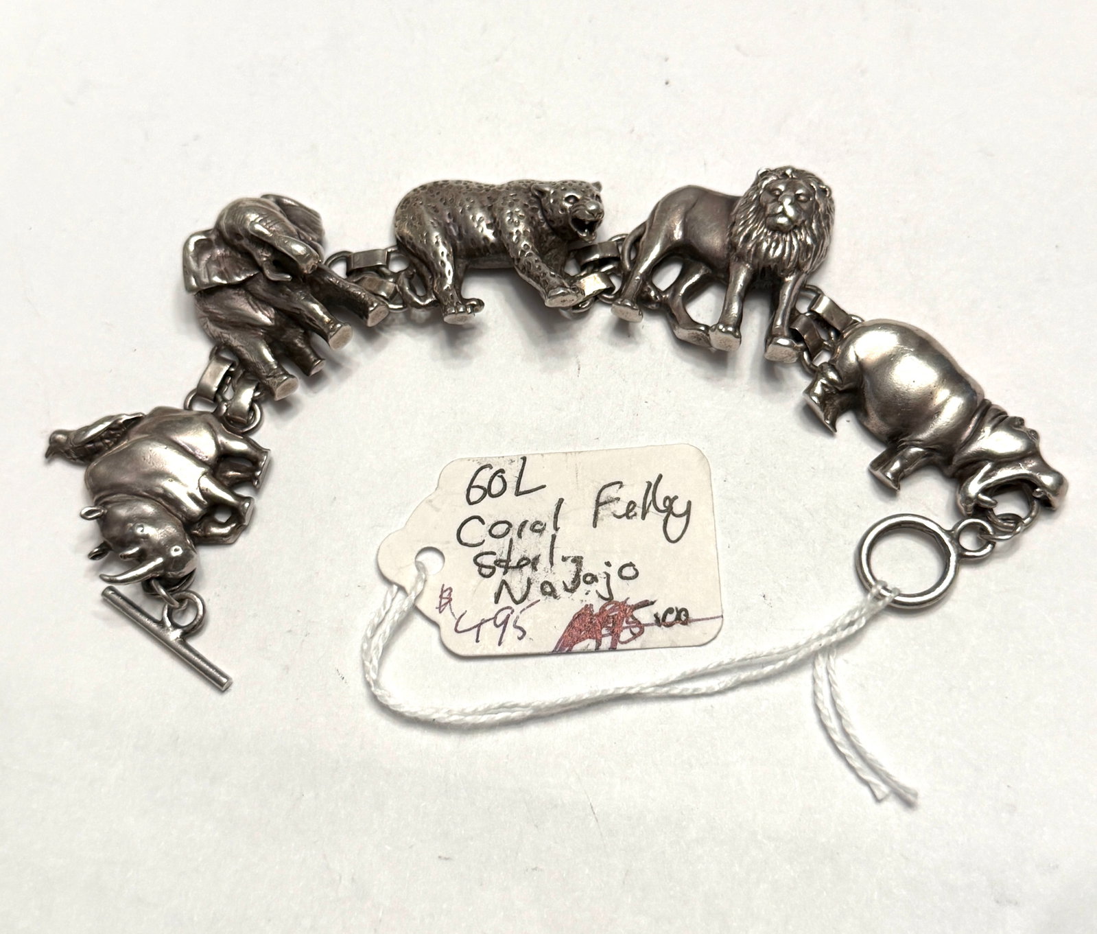 Coral Felky Navajo Sterling Silver Safari Animal Link Bracelet: Unique vintage Navajo sterling silver safari animal bracelet by Coral Felky featuring detailed three-dimensional animal links including an elephant, leopard, lion, rhinoceros, and hippopotamus with he