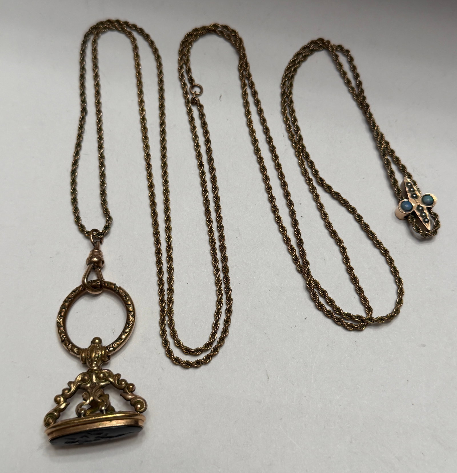Antique Victorian Style Fob Necklace with Intaglio Pendant & Decorative Slide Chain: Beautiful antique Victorian-style necklace featuring an ornate intaglio-style fob pendant suspended from a twisted rope chain with decorative slide accent. The pendant showcases intricate scrollwork d