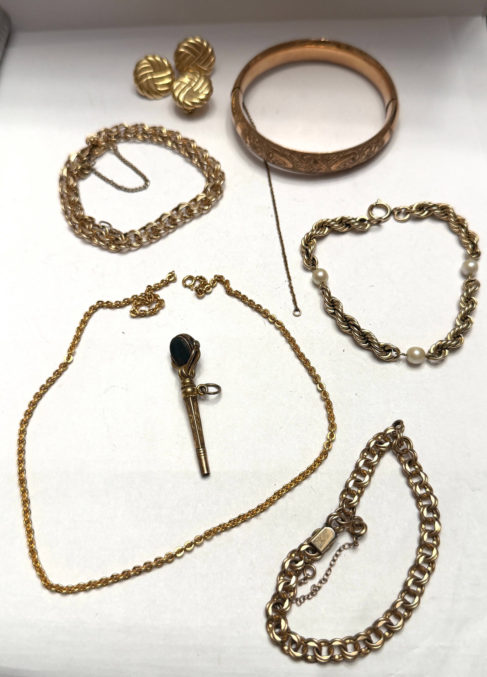 Untested Vintage Jewelry Scrap Lot 14K Marked Earrings & Gold Tone Chains Bangle Earrings 48.1 DWT: Mixed vintage jewelry scrap and wearable lot featuring assorted gold tone and possibly gold content pieces including a bracelet marked “14K,” engraved hinged bangle bracelet with safety ch