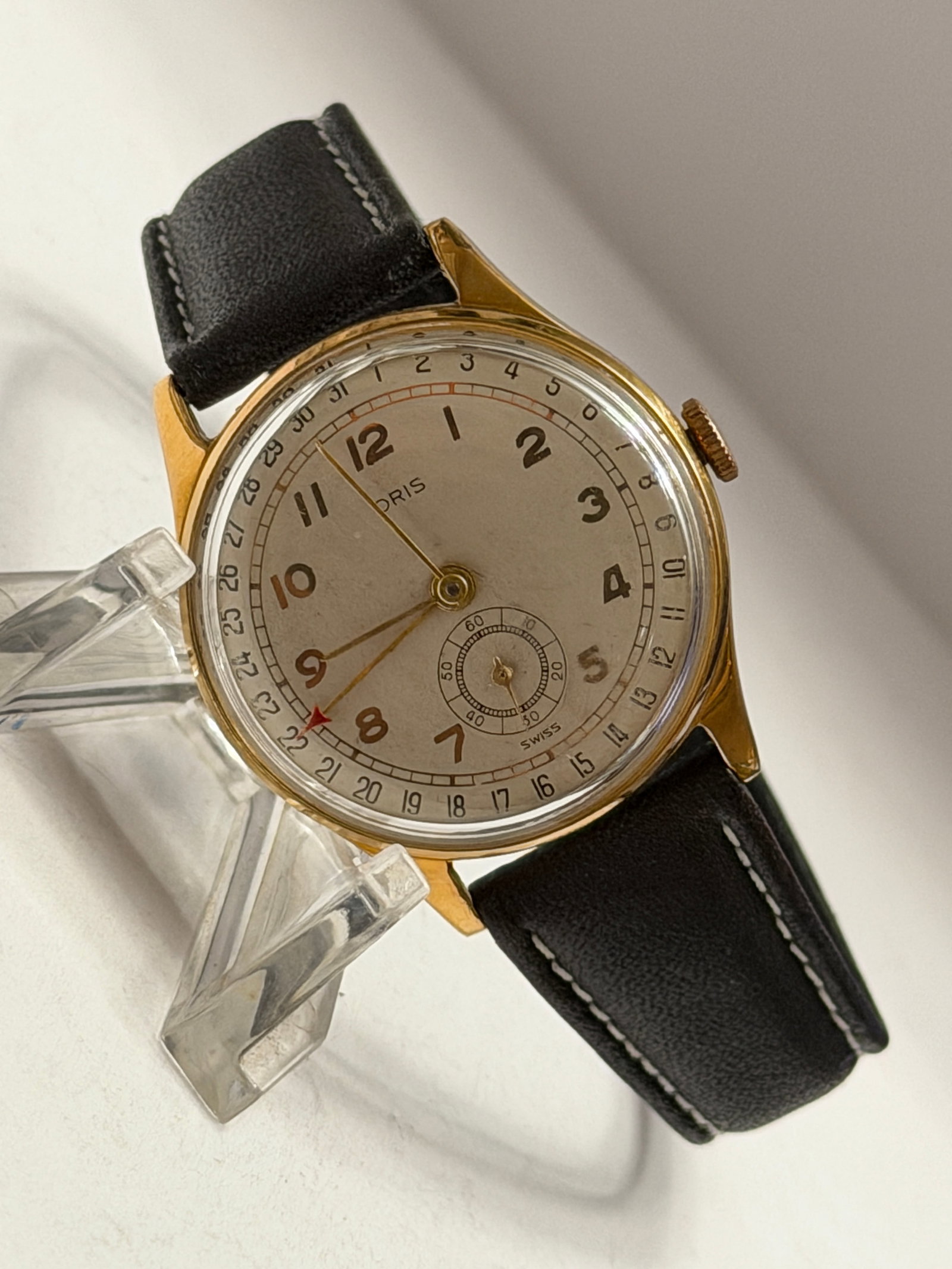 Vintage Oris Pointer Date Manual Wind Wristwatch Gold Tone: Vintage Oris manual wind wristwatch featuring gold tone case, silver dial with large Arabic numeral hour markers, center pointer date hand with outer date track, and subsidiary seconds dial at 6 oR