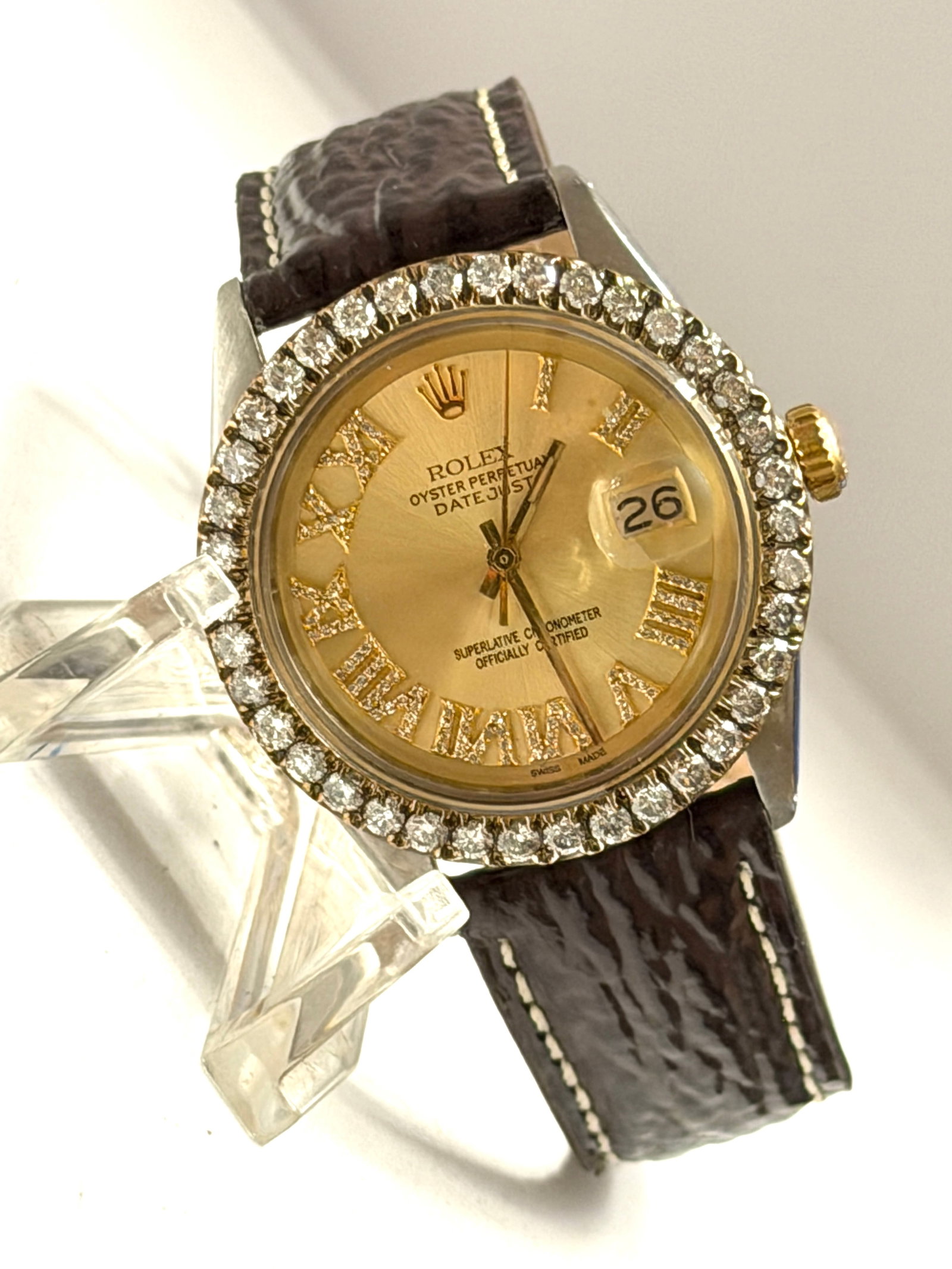 Rolex Oyster Perpetual Datejust Ref. 1601 Custom Diamond Bezel Automatic Wristwatch: Vintage Rolex Oyster Perpetual Datejust automatic wristwatch, reference 1601, featuring a stainless steel case with yellow gold crown and aftermarket diamond-set bezel. The champagne dial is accented 