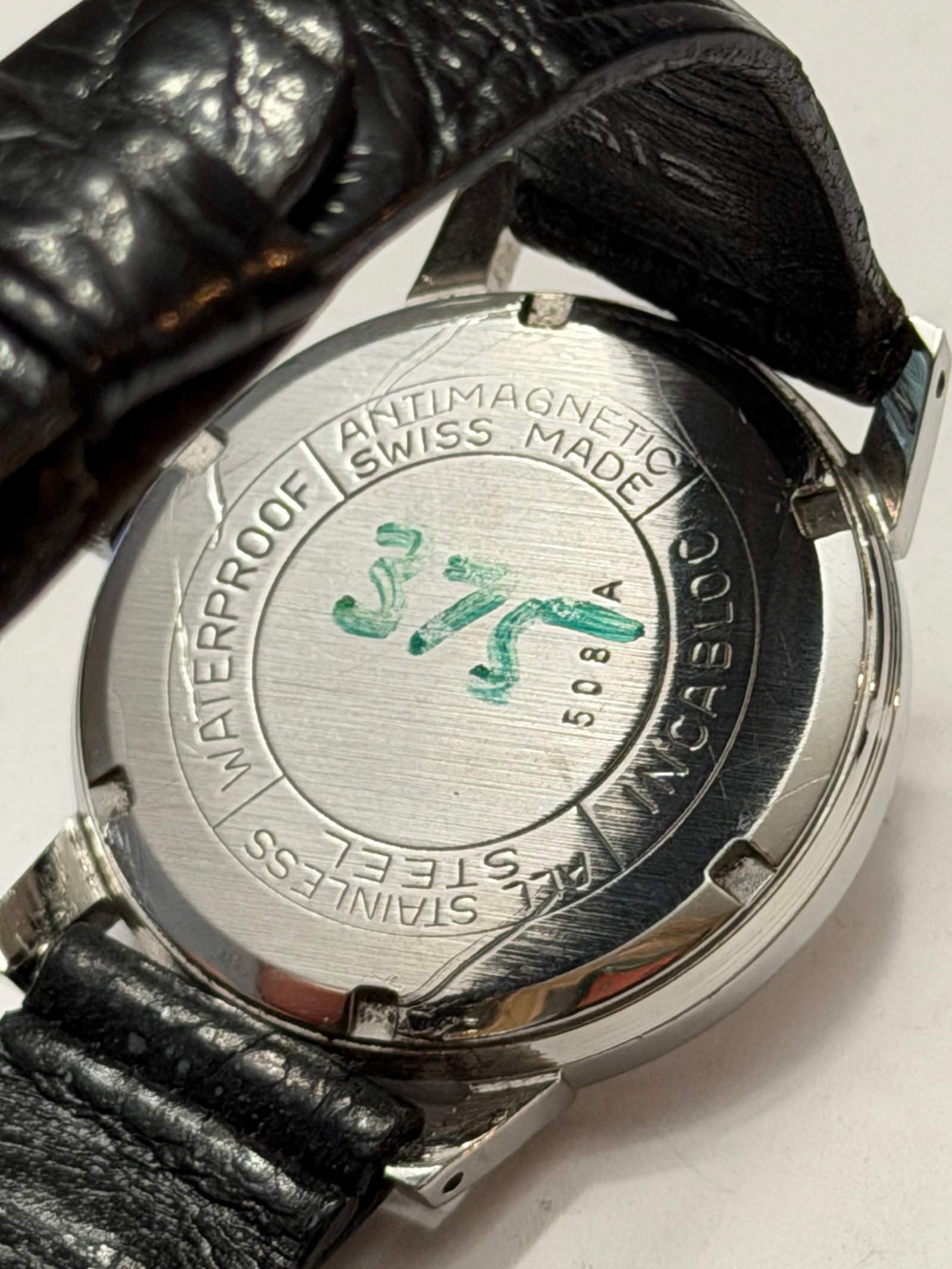 Turler Date Wristwatch ? Stainless Steel Swiss Dress Watch with Applied Markers: Elegant vintage Türler Swiss wristwatch featuring a clean mid-century minimalist design with classic date complication and sharp angular lugs. The silver sunburst dial is beautifully understated,