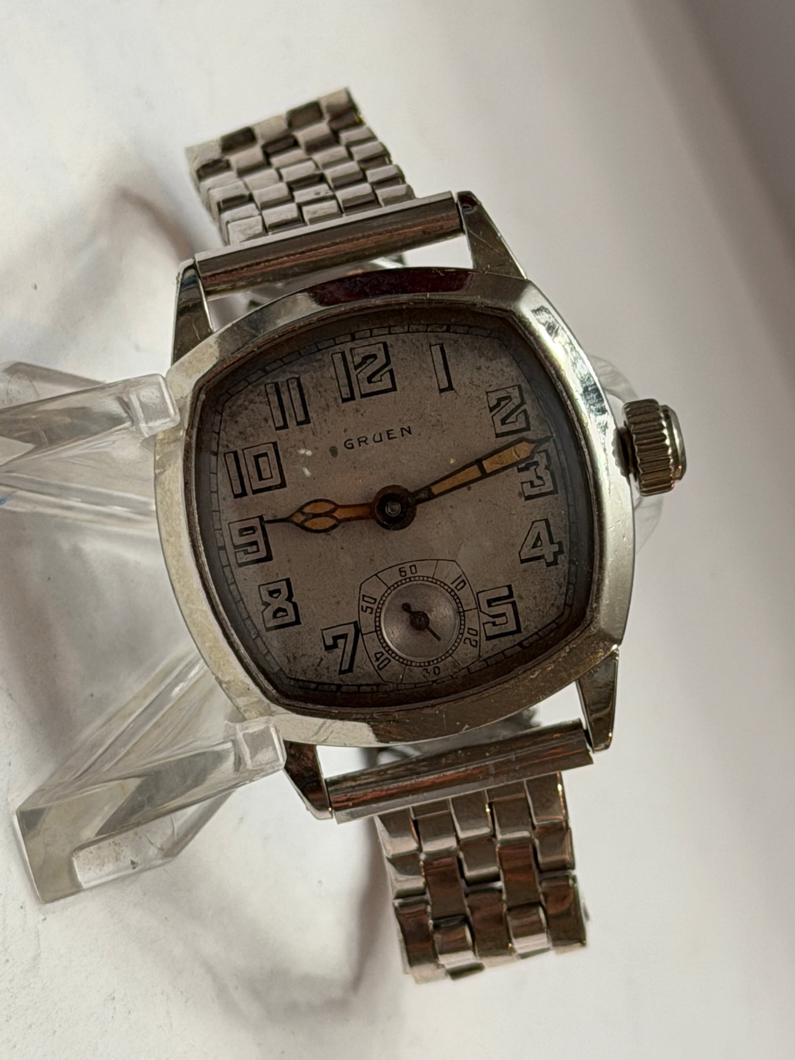 Gruen Cushion Case Art Deco Wristwatch with Small Seconds Dial: Elegant vintage Gruen wristwatch featuring a classic cushion-shaped case and beautifully aged Art Deco style dial that captures the timeless sophistication of early 20th century watchmaking. The silve