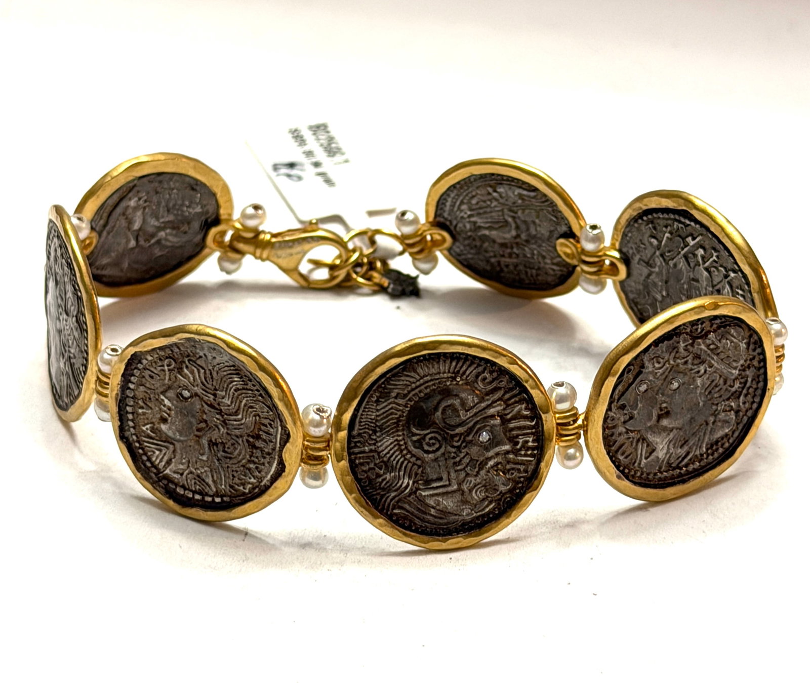 Ancient Roman Coin Style Gold Vermeil Sterling Silver Bracelet with Pearls & Diamond Accent: Striking artisan bracelet crafted in sterling silver with luxurious 18K gold vermeil finish, featuring a series of ancient Roman coin inspired medallions framed in organic hand formed bezels. Each coi