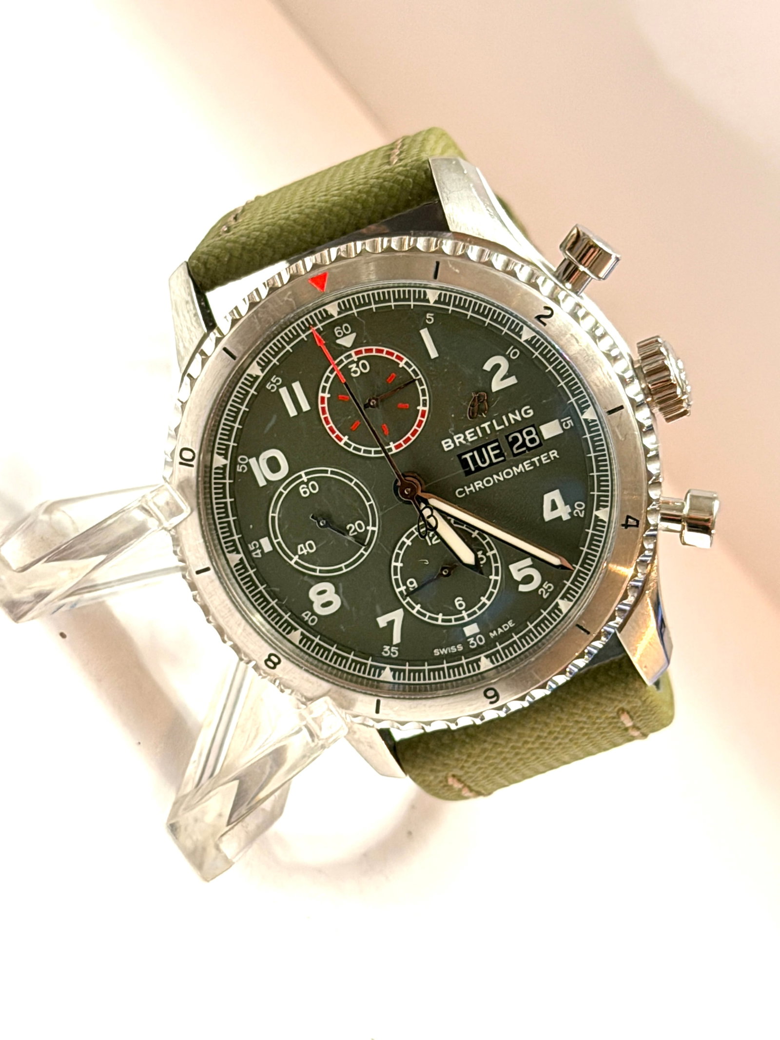 Breitling Curtiss Warhawk Chronograph Automatic Men?s Watch A13316 Green Dial: Exceptional Breitling Curtiss Warhawk Chronograph featuring a distinctive military-inspired green dial paired with a matching olive textured leather strap. This special edition aviation chronograph ho