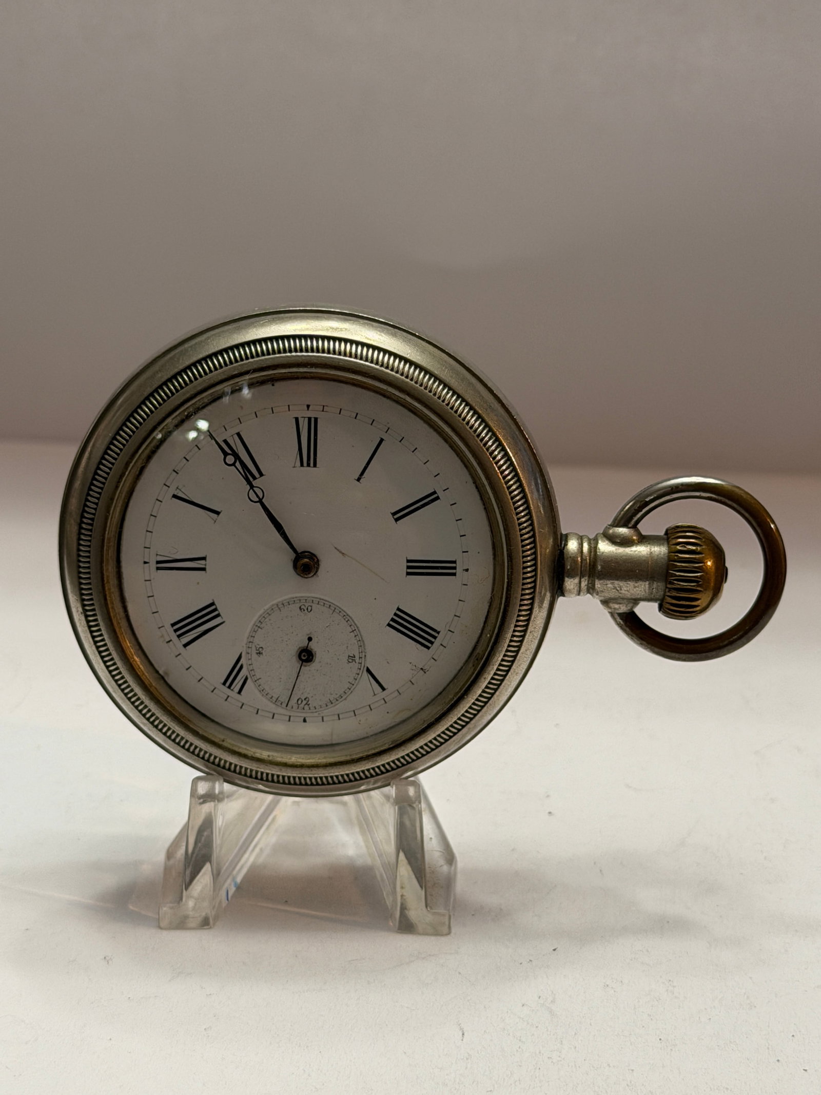 Antique H.H. Heinrich Open Face Pocket Watch ? Display Back ? For Restoration/Service: Antique H.H. Heinrich open face pocket watch featuring a classic white enamel dial with black Roman numeral hour markers and subsidiary seconds register at 6 o’clock. The watch has elegant blued