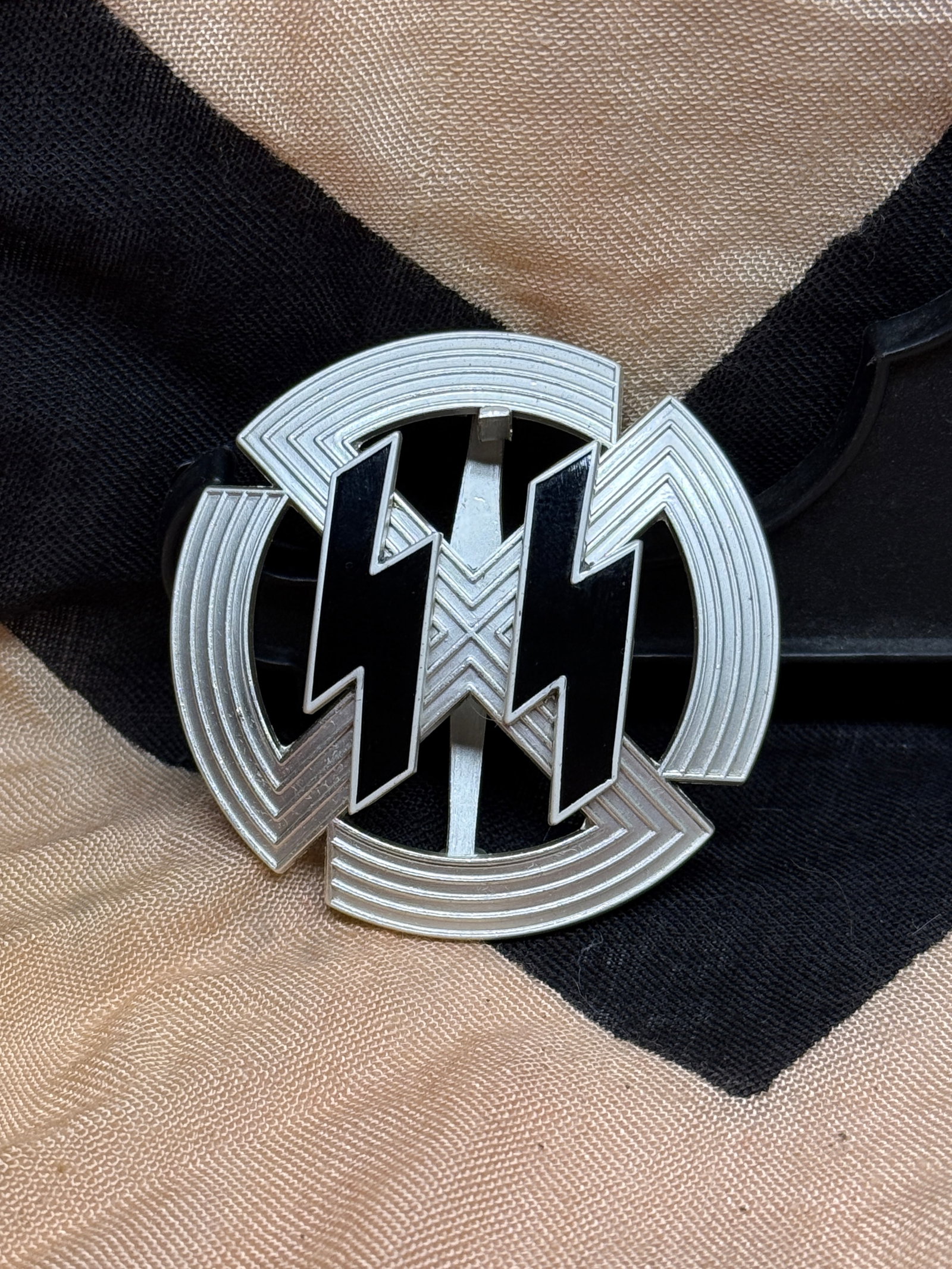 WWII German SS Membership Lapel Pin Badge M1/25 RZM Marked Black Enamel: German SS-style membership lapel pin featuring the distinctive twin Sig rune design in black enamel over a silver-toned circular background. The reverse is marked “M1/25” and displays the RZM 
