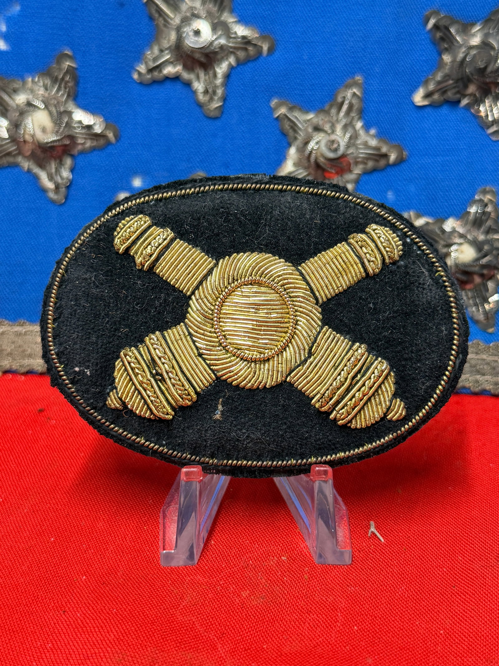 Civil War Artillery Bullion Headgear Badge Crossed Cannons on Black Wool Backing: Offered here is a Civil War era artillery headgear badge featuring crossed cannons executed in fine gold-colored bullion wire on a black wool backing. The design displays excellent visual appeal with 