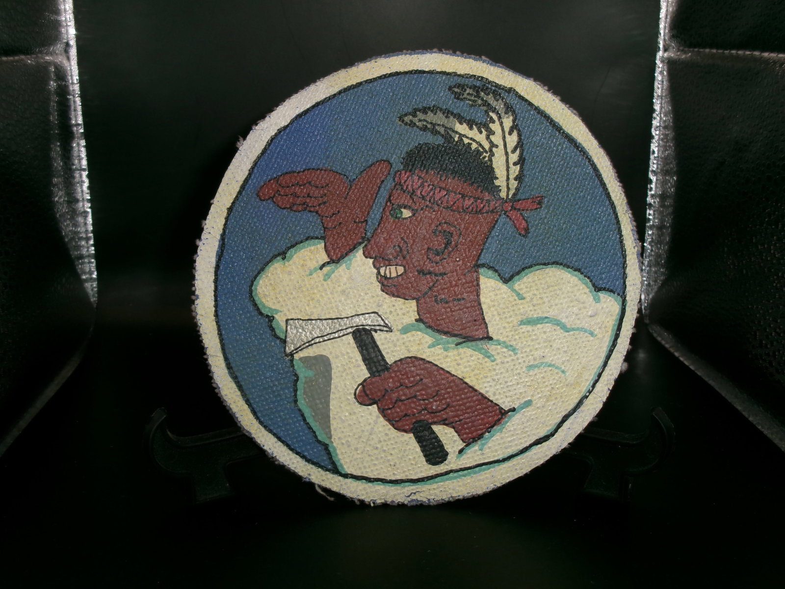 WWII USAAF 2nd Scouting Force 8th Air Force Indian Theater Patch: German Third Reich "Heim ins Reich" enamel lapel badge featuring a red swastika set within a white enamel field and black border bearing the inscription "HEIM INS REICH." The badge is circular in form