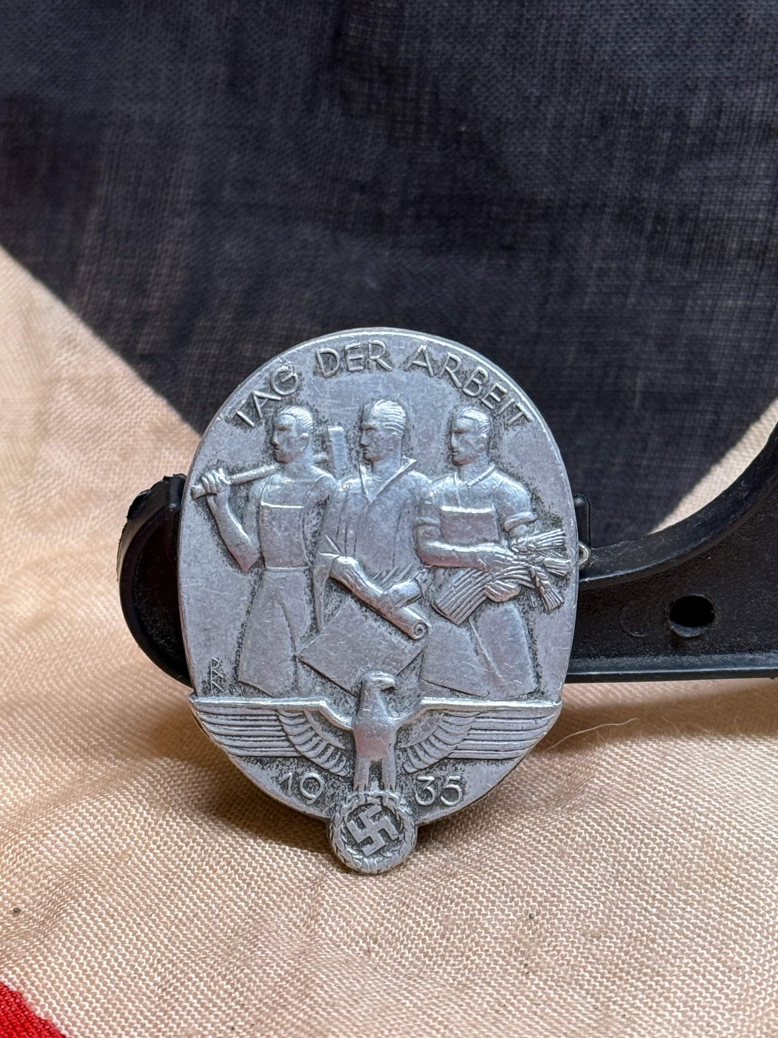 WWII German Tag der Arbeit 1935 Tinnie Badge Marked M.O.S. (1 of 3)