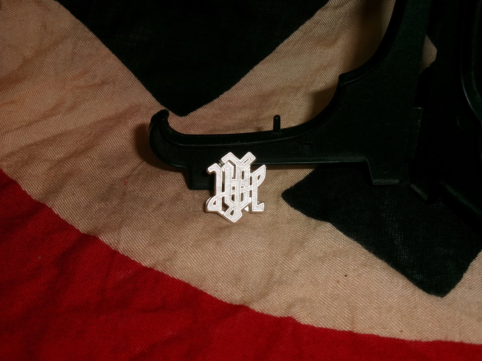 WWII German Waffen-SS Leibstandarte Adolf Hitler (LAH) Metal Uniform Cypher (1 of 3)