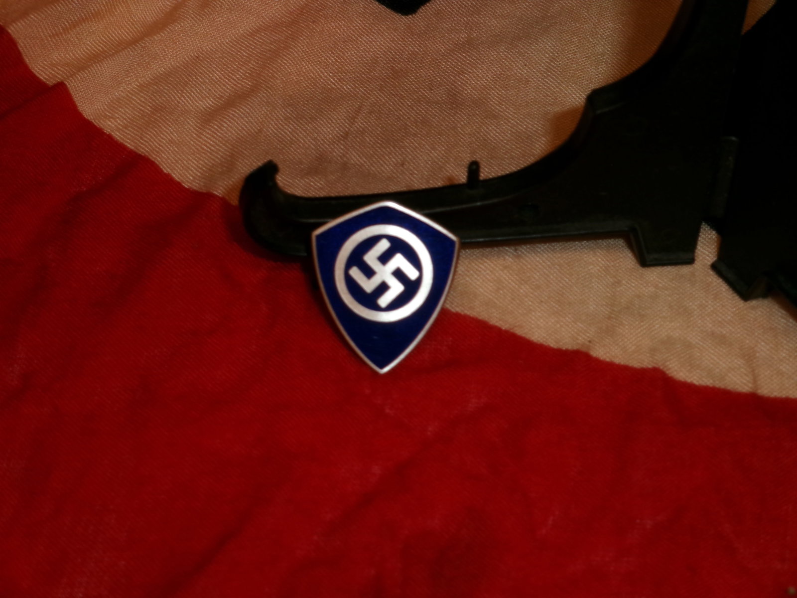 WWII German National Socialist Motor Corps (NSKK) Membership Badge: World War II German Waffen-SS field-grey wool service tunic attributed to the 2nd SS Panzer Division “Das Reich.” The tunic features black collar tabs including SS runic insignia, silver-trimm
