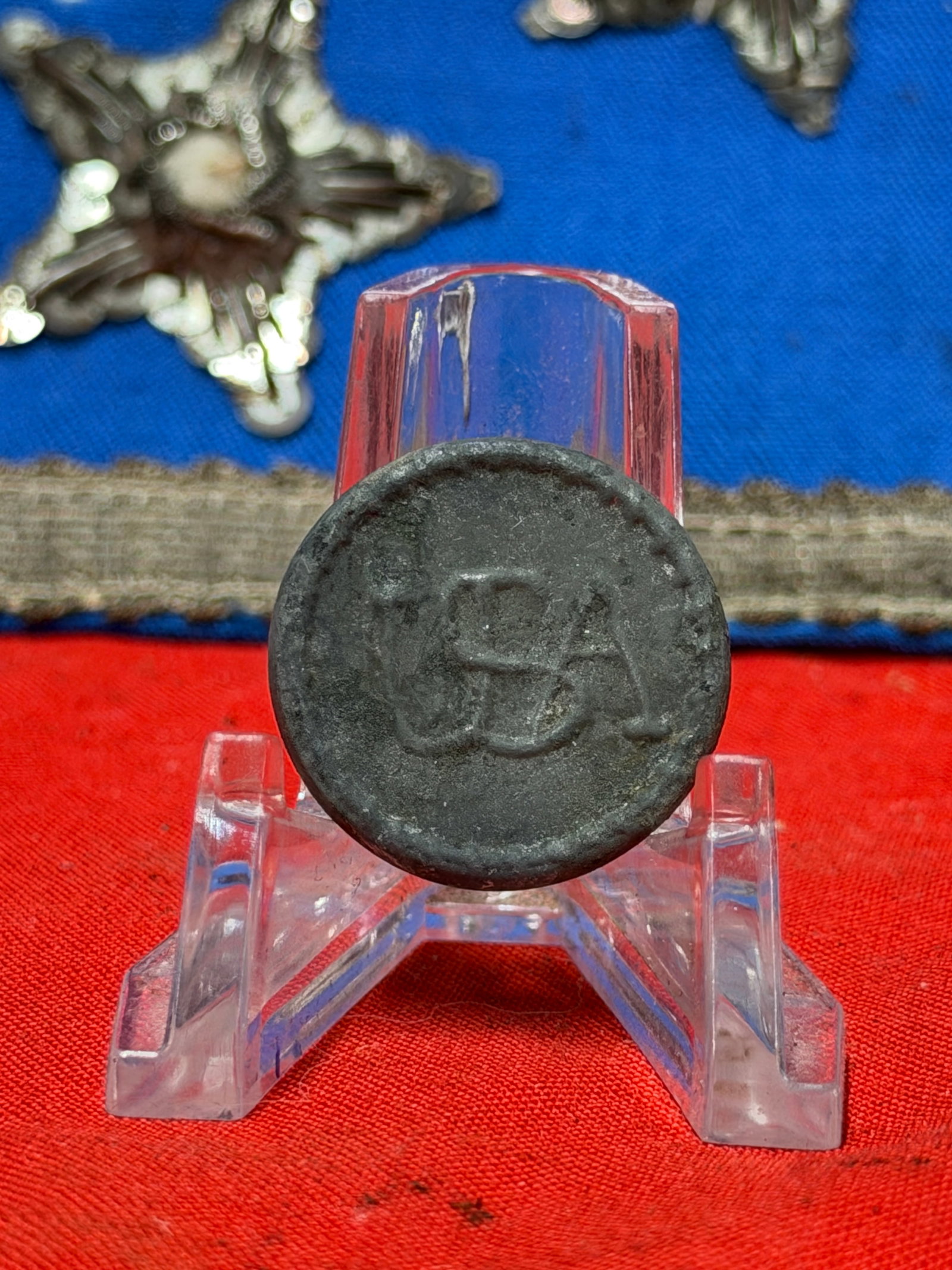 Early USA Pewter Military Button Revolutionary War Era Style 7/8 Inch: Early pewter button featuring the raised letters "USA" on the face and a loop shank on the reverse. Measures approximately 7/8 inch in diameter. The button exhibits a dark aged surface, oxidation, edg