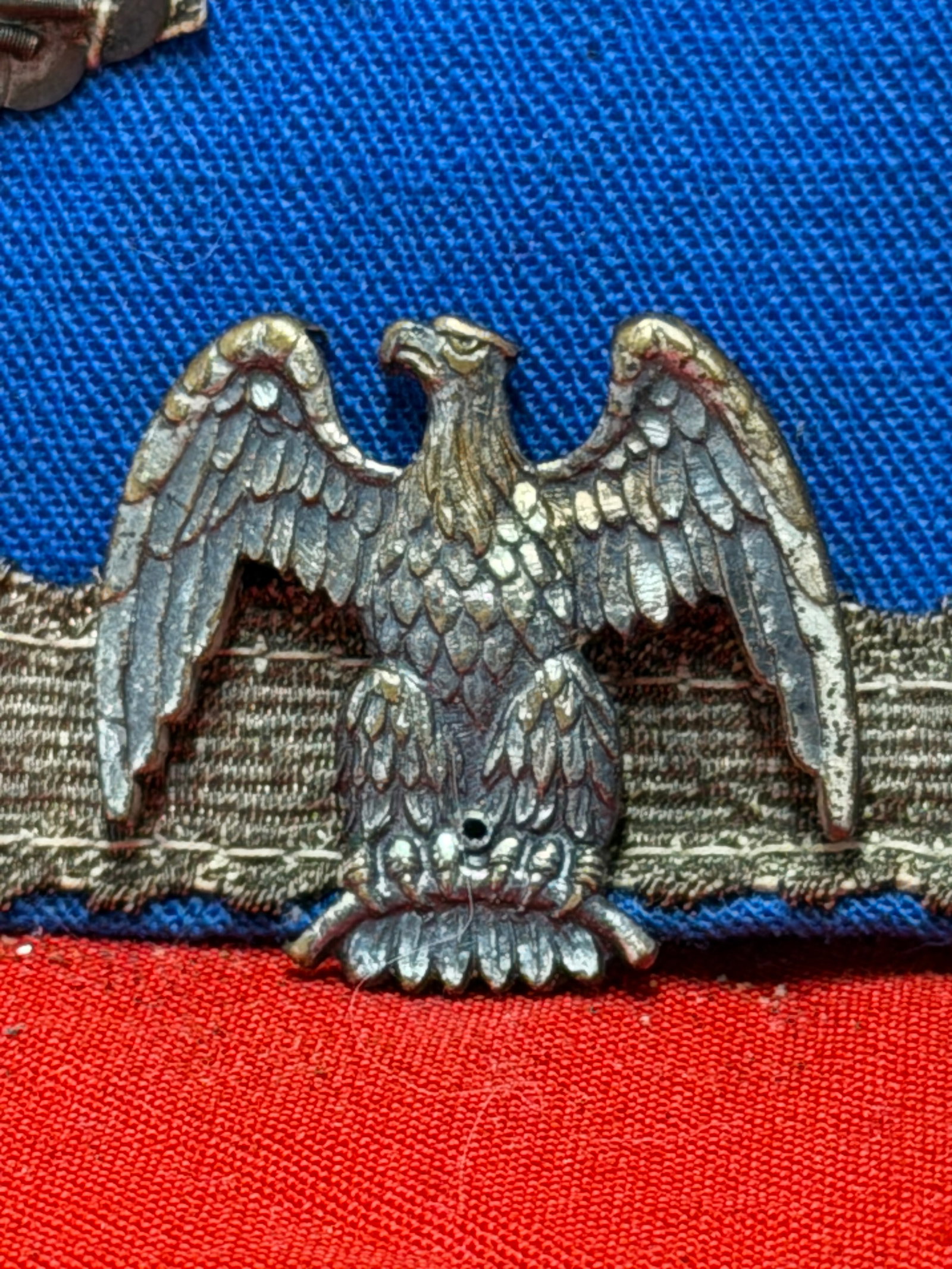 Civil War Confederate CSA Eagle Uniform Insignia Hat Device: Offered is a Civil War Confederate States of America (CSA) eagle insignia featuring a spread-wing eagle with detailed feathering and a perched design. The piece measures approximately 1 inch across an