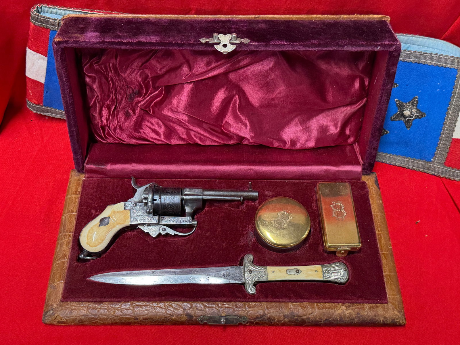 Civil War Era Cased Engraved Percussion Revolver & Edward Barnes Knife Gentleman’s Set: Offered for sale is an exceptional Civil War era cased percussion revolver and knife set dating to the mid-19th century, circa 1850s–1860s. The fitted presentation case is lined in rich burgundy vel