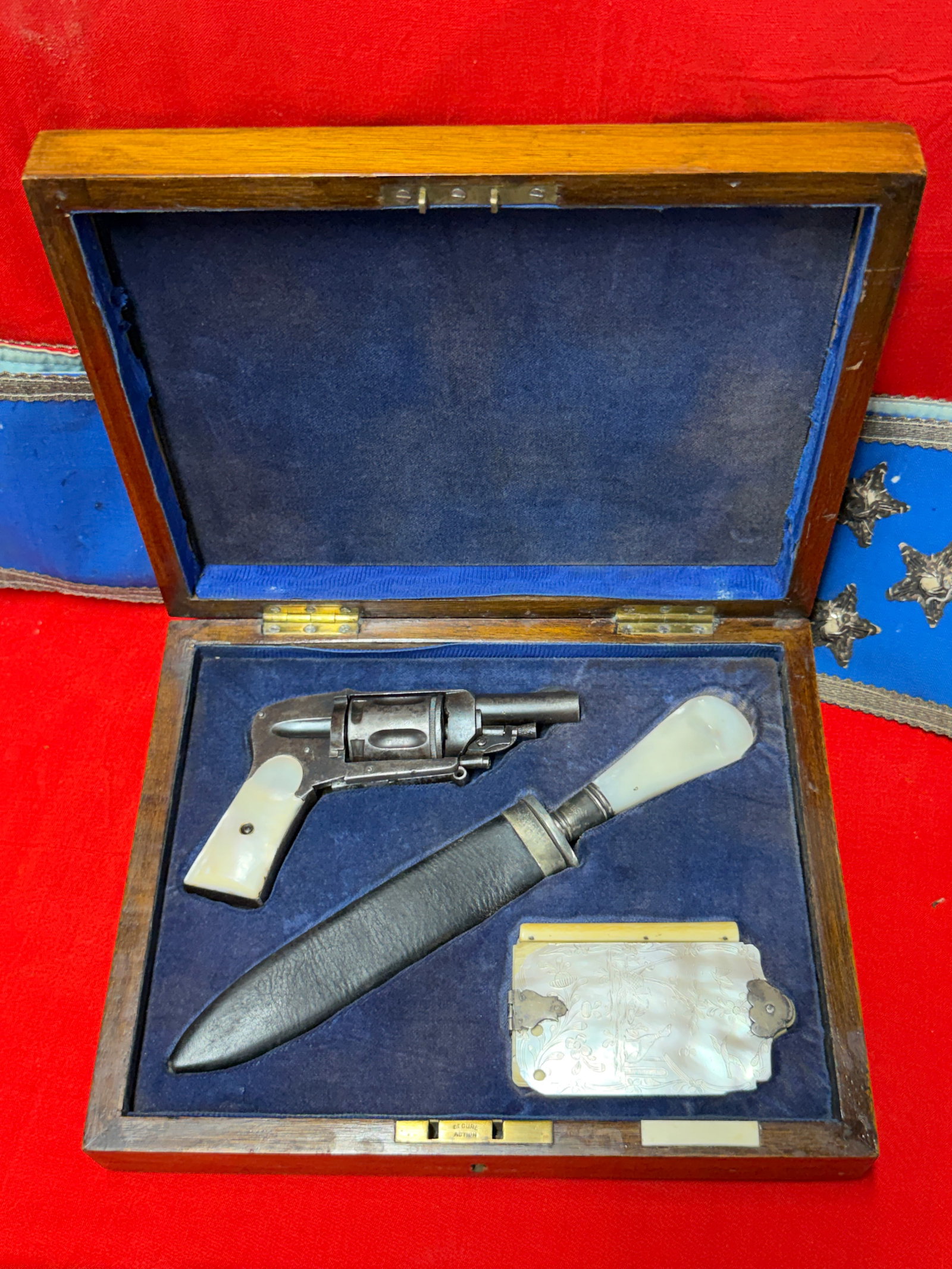 1800's Tiffany & Co. New York Cased Gentleman’s Revolver, Dagger & Mother-of-Pearl Dance Card Set: Exceptional late 19th century gentleman’s accessory set housed in its original fitted presentation case. The set includes a compact revolver, a Tiffany & Co. New York marked dagger with mother-of-pe
