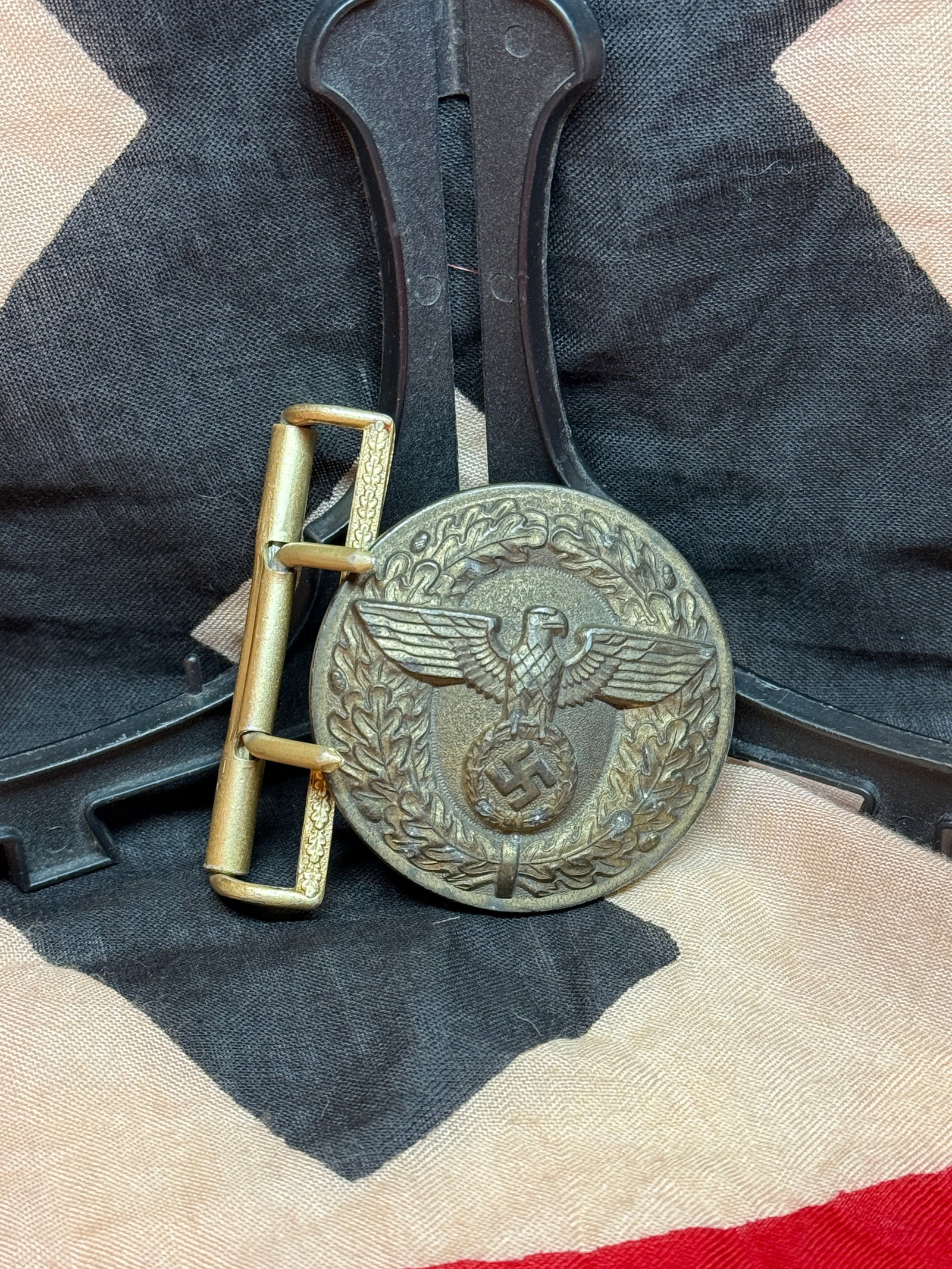 WWII German NSDAP Organization Belt Buckle, RZM Marked M4/39: This circular belt buckle features a national eagle standing above a swastika enclosed within an oak leaf wreath, a design closely associated with political organizations operating under the National 