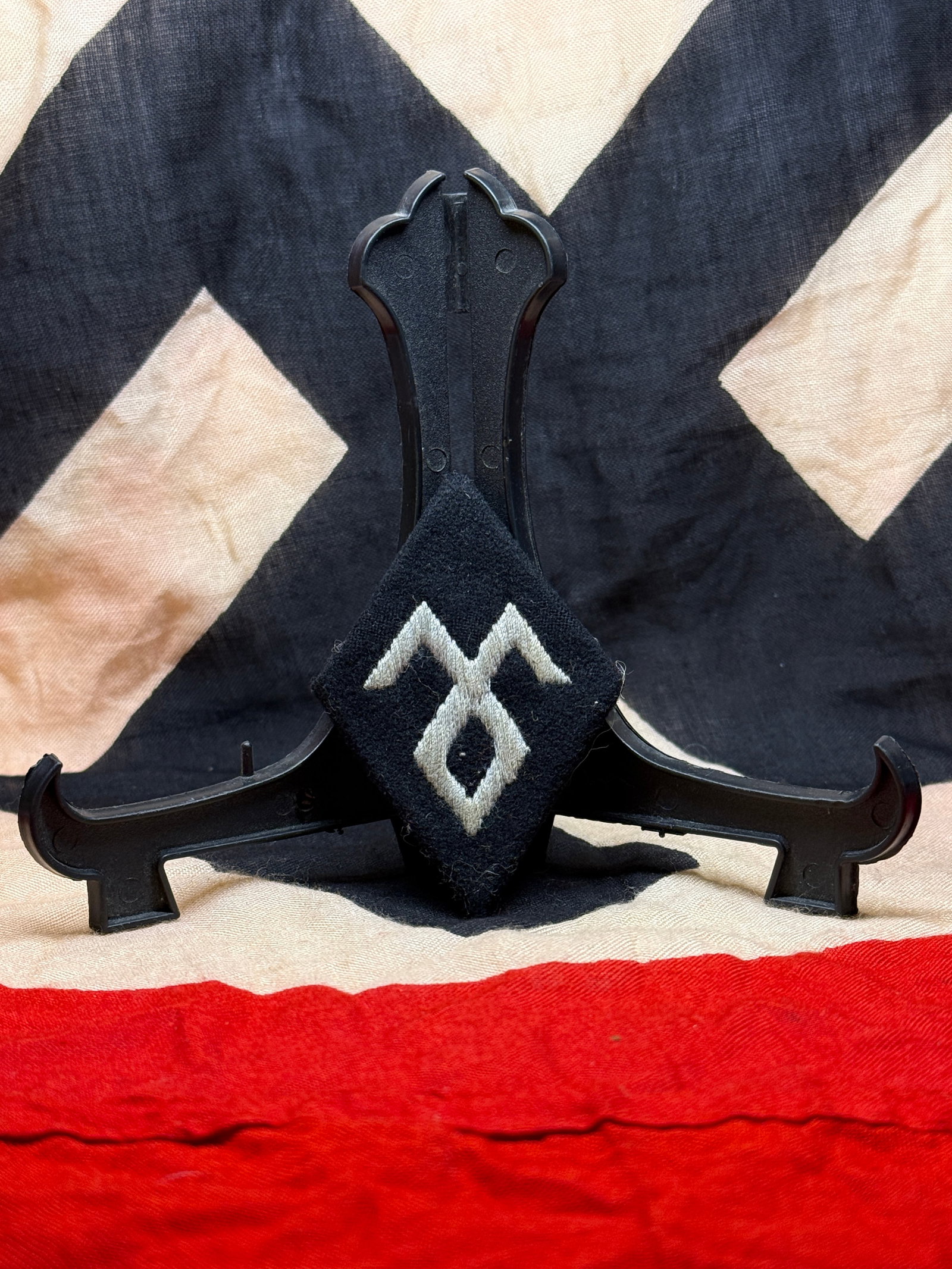 WWII German Waffen-SS Collar Tab, 7th SS Volunteer Mountain Division "Prinz Eugen": This embroidered black cloth collar tab is associated with the 7th SS Volunteer Mountain Division "Prinz Eugen," a Waffen-SS formation established in 1941 and composed largely of ethnic German volunte