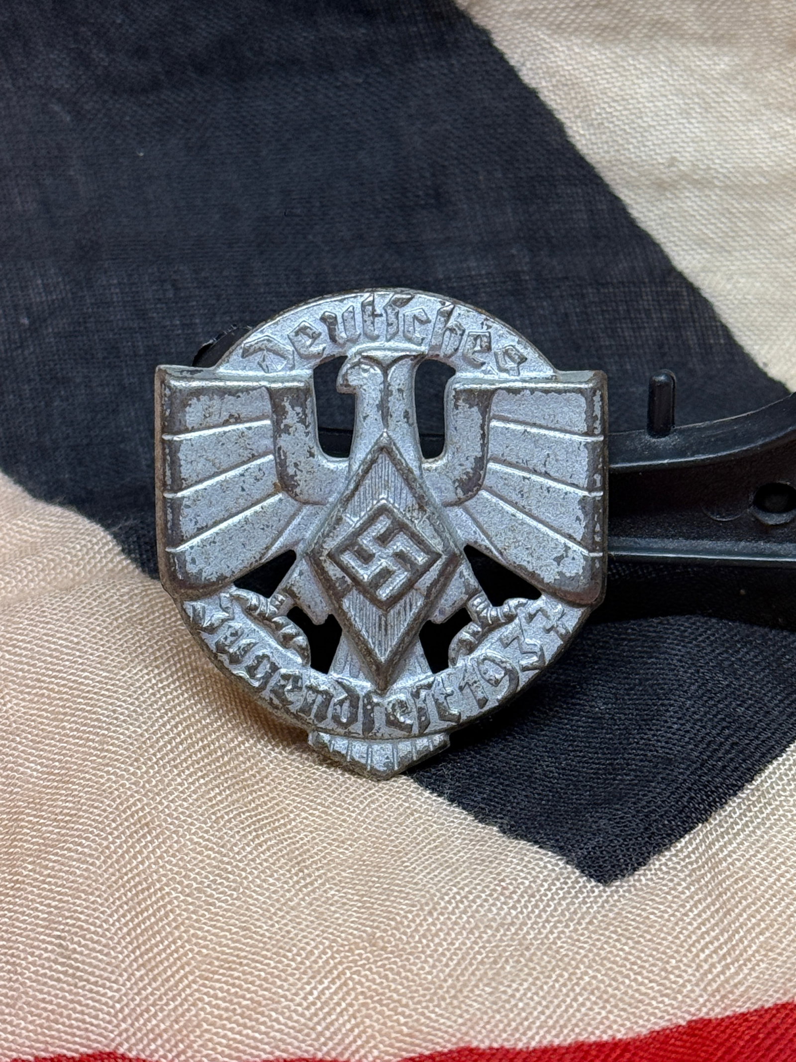 1930s German Youth Festival (“Deutsches Jugendfest??) Commemorative Tinnie: This stamped metal commemorative badge was issued for a German Youth Festival (Deutsches Jugendfest) during the National Socialist period. The design features an eagle with outstretched wings above a 