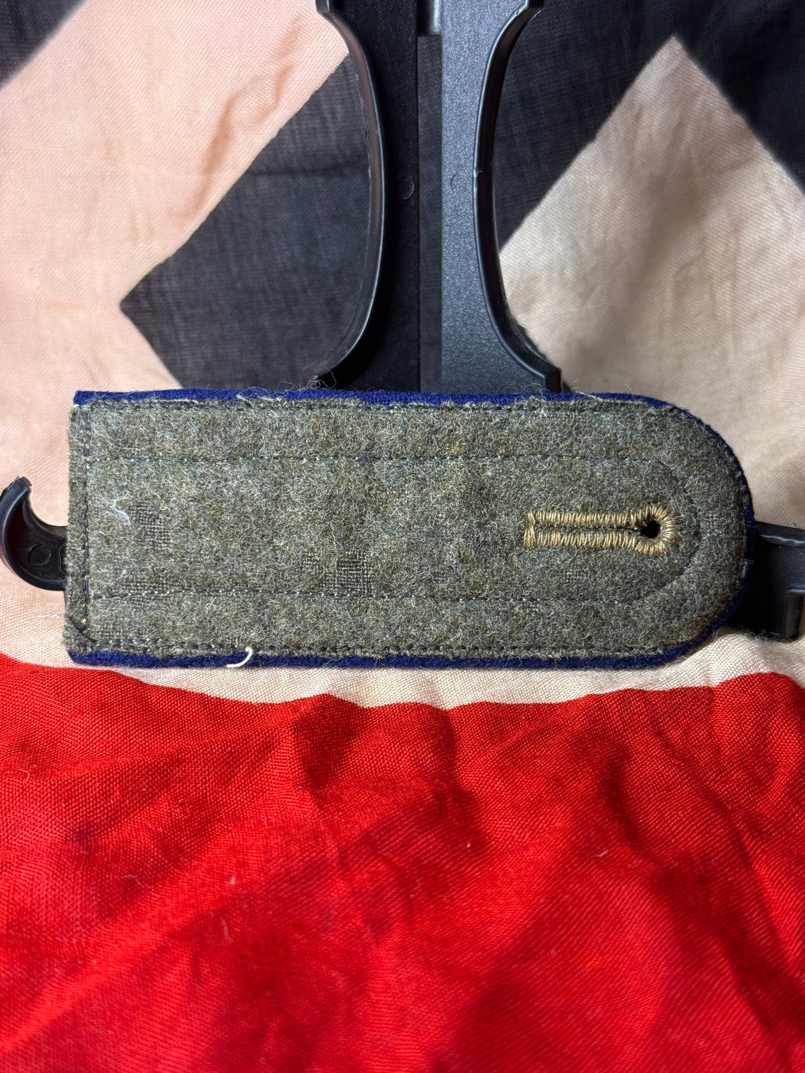 WWII German Army (Heer) Officer Shoulder Board: Constructed of silver-colored officer braid mounted on a dark blue underlay, this shoulder board was worn by an officer of the German Army (Heer) during the Second World War. Shoulder boards served as