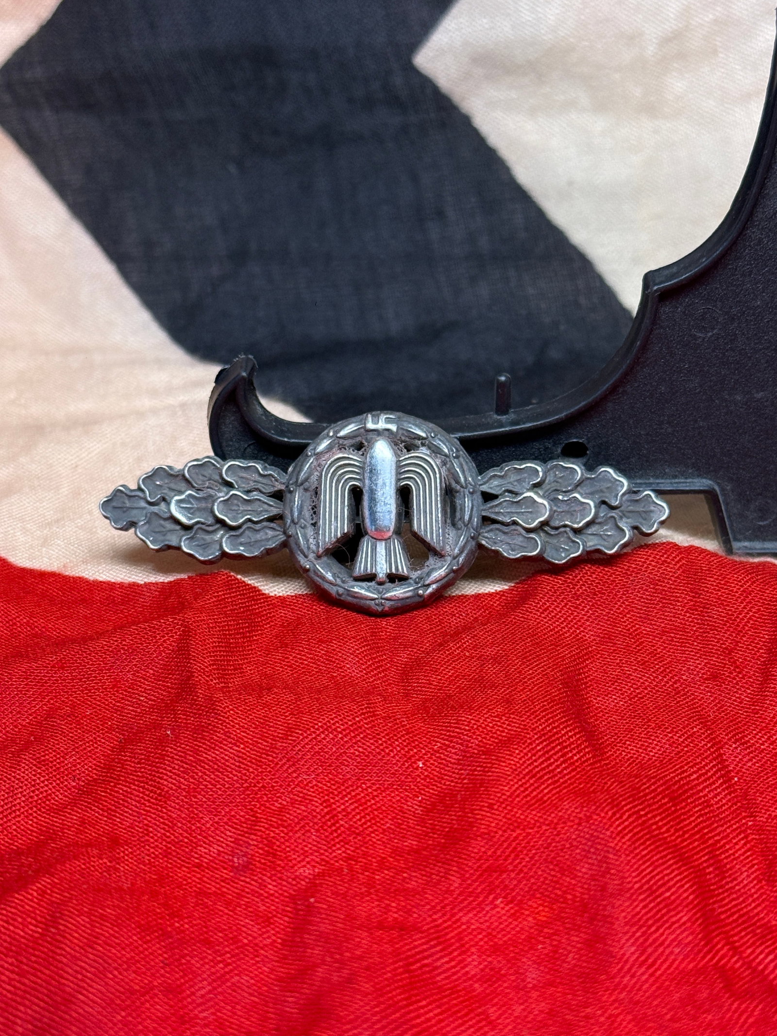 WWII German Luftwaffe Ground Assault Badge (Erdkampfabzeichen der Luftwaffe): This Luftwaffe Ground Assault Badge features a central winged device within a wreath and flanked by stylized oak leaves. Instituted in 1942, the decoration was awarded to Luftwaffe personnel who parti