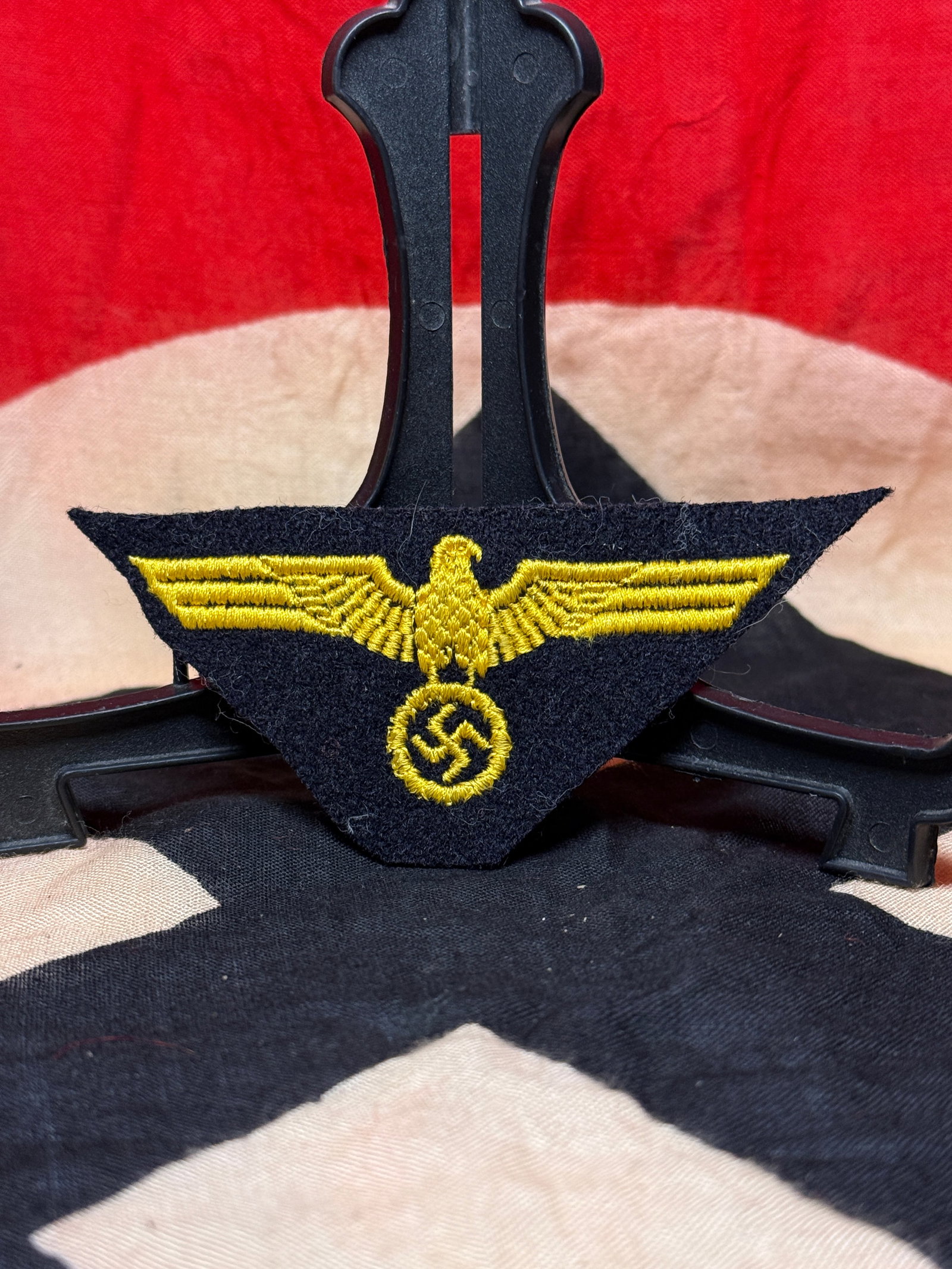World War II German Kriegsmarine Breast Eagles, Pair: Matched pair of embroidered German Kriegsmarine breast eagles produced for wear on naval uniforms during the Second World War. Both insignia feature the national eagle with outstretched wings above a 