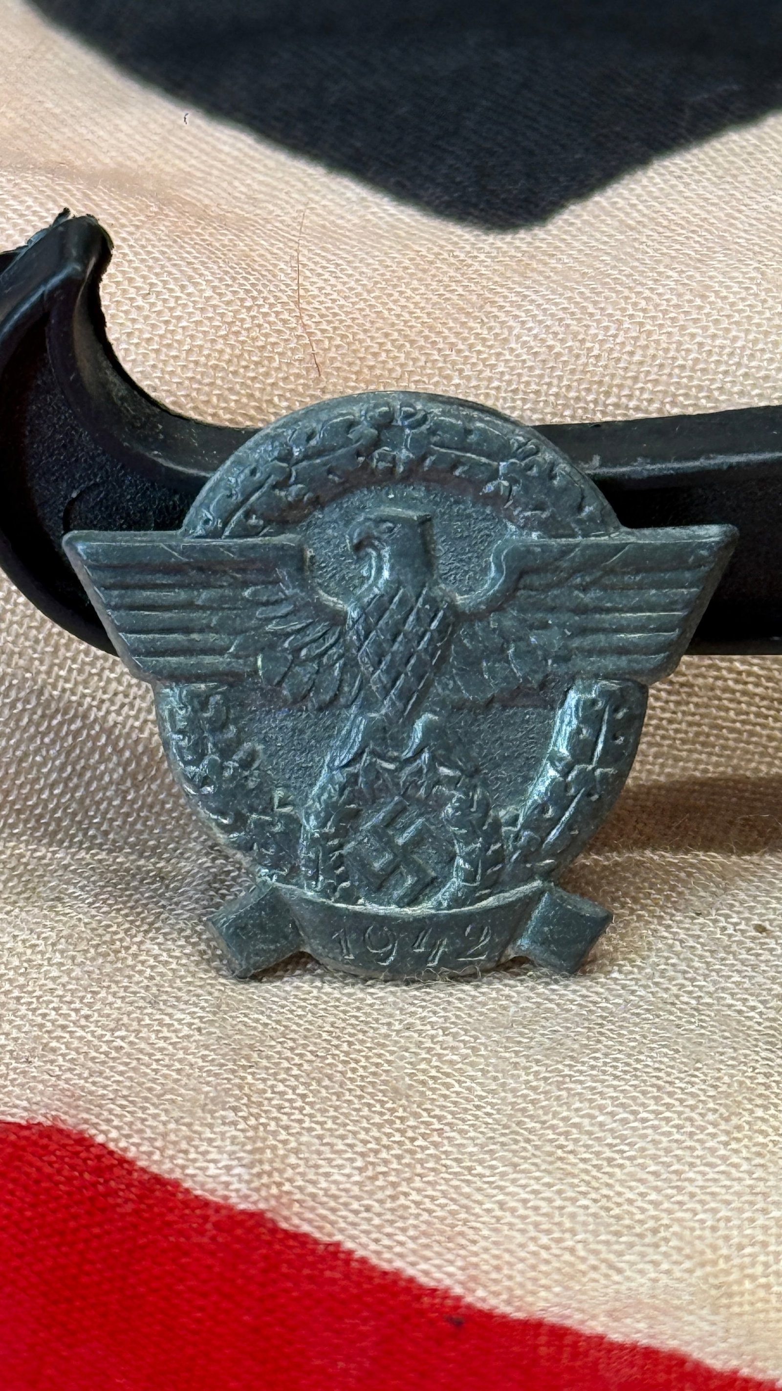WWII German "Tag Der Polizei" 1942 Police Day Tinnie Badge: This commemorative German Police Day (Tag Der Polizei) tinnie features the national eagle with outstretched wings above a wreath enclosing a swastika, flanked by police-style insignia and dated 1942 a